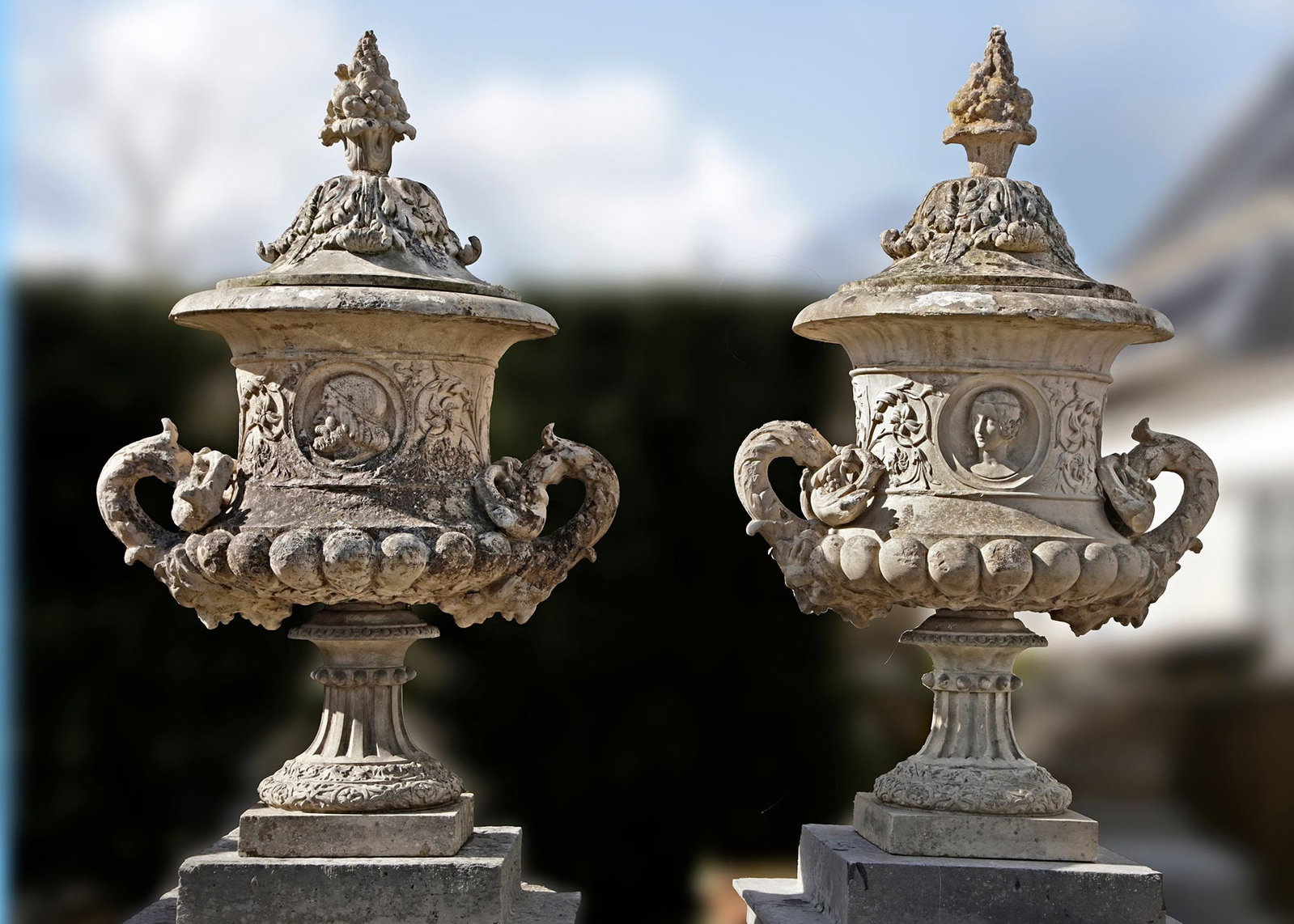 A PAIR OF MONUMENTAL TERRACOTTA GARDEN URNS WITH LID AND SWAN HANDELS, 19TH CENTURY: In classical mythology, swans represent fidelity and eternal love, as it was believed that swans choose a partner for life. In Greek mythology the swan is associated with the gods Apollo, god of music