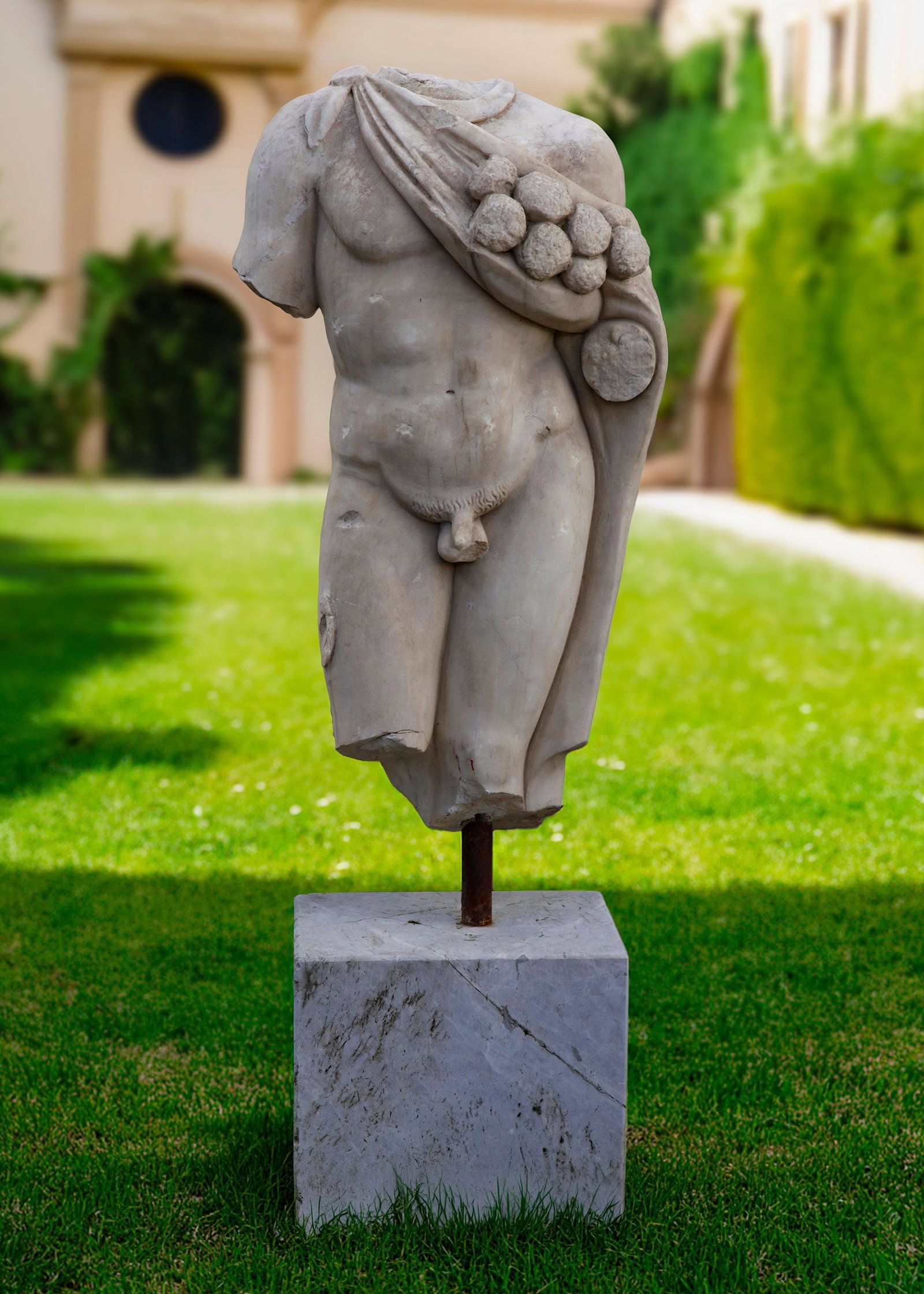 A ROMAN MARBLE TORSO: Height overall 146 cm. Height of the base 38 cm. and square 40 by 30 cm.