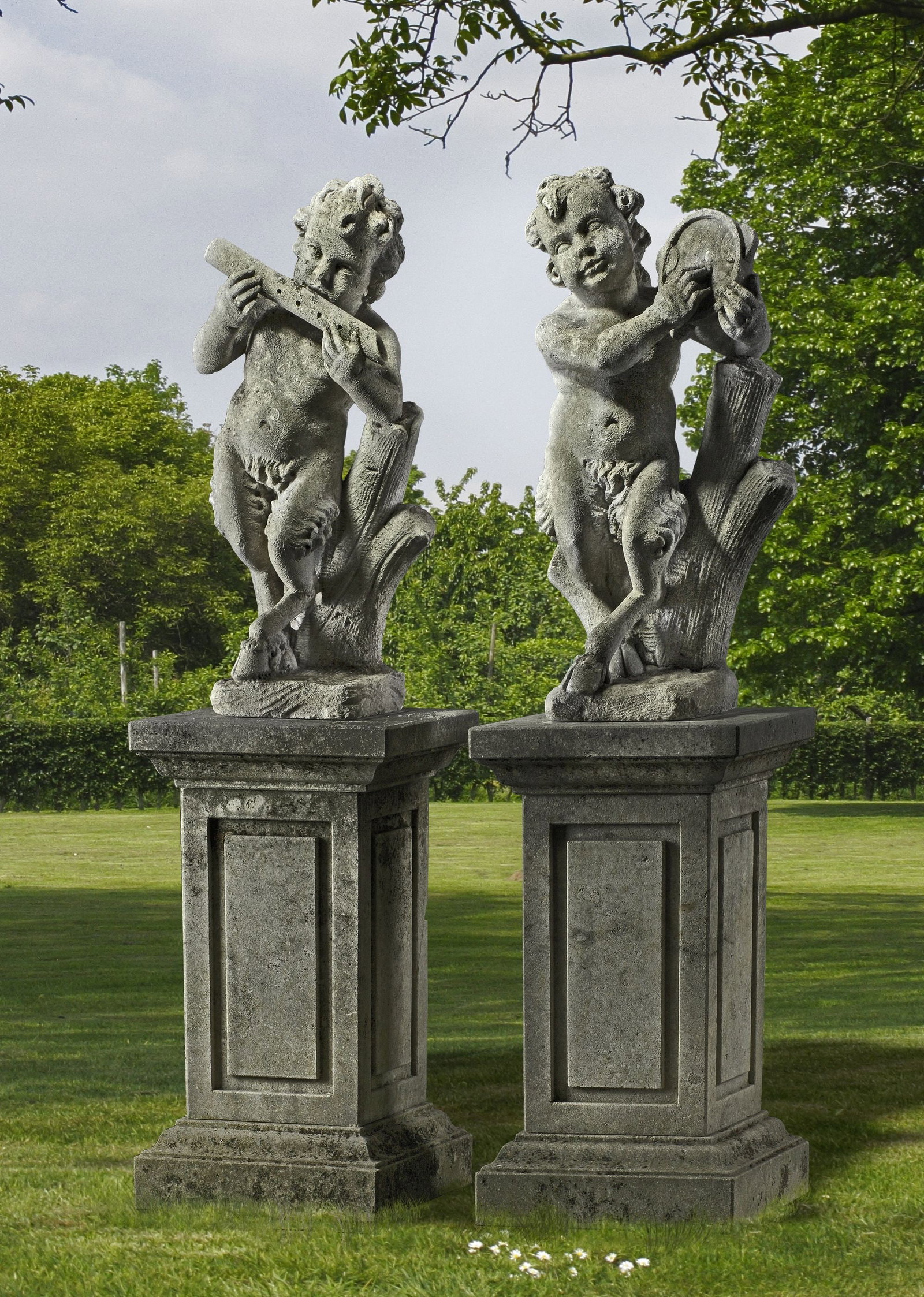 A PAIR OF CONTINENTAL SCULPTED LIMESTONE MODELS OF INFANT MUSICIAN FAUNS, LATE 19TH OR EARLY 20TH (1 of 1)