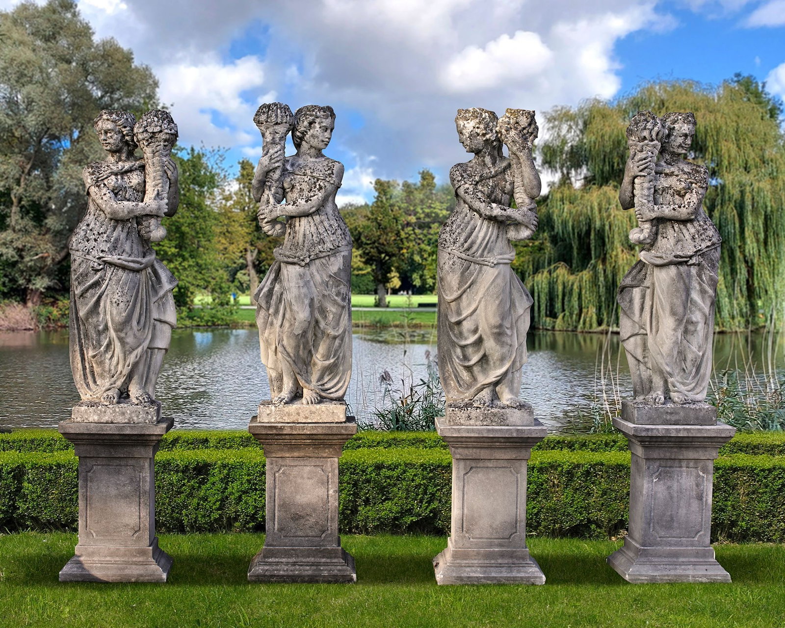A SET OF FOUR SCULPTED LIMESTONE MODELS OF MAIDENS REPRESENTING THE FOUR SEASONS, LATE 19TH CENTURY (1 of 1)