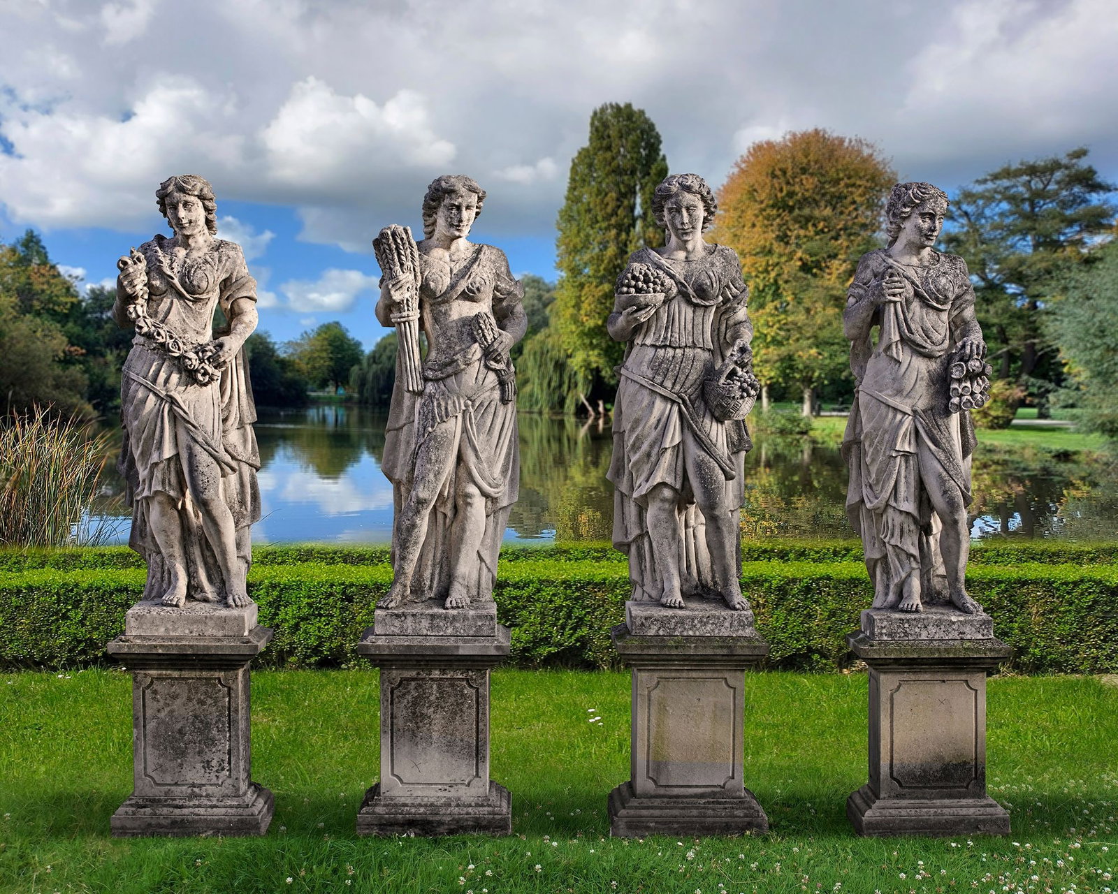 A SET OF FOUR SCULPTED LIMESTONE MODELS OF MAIDENS REPRESENTING THE FOUR SEASONS, LATE 19TH CENTURY (1 of 1)
