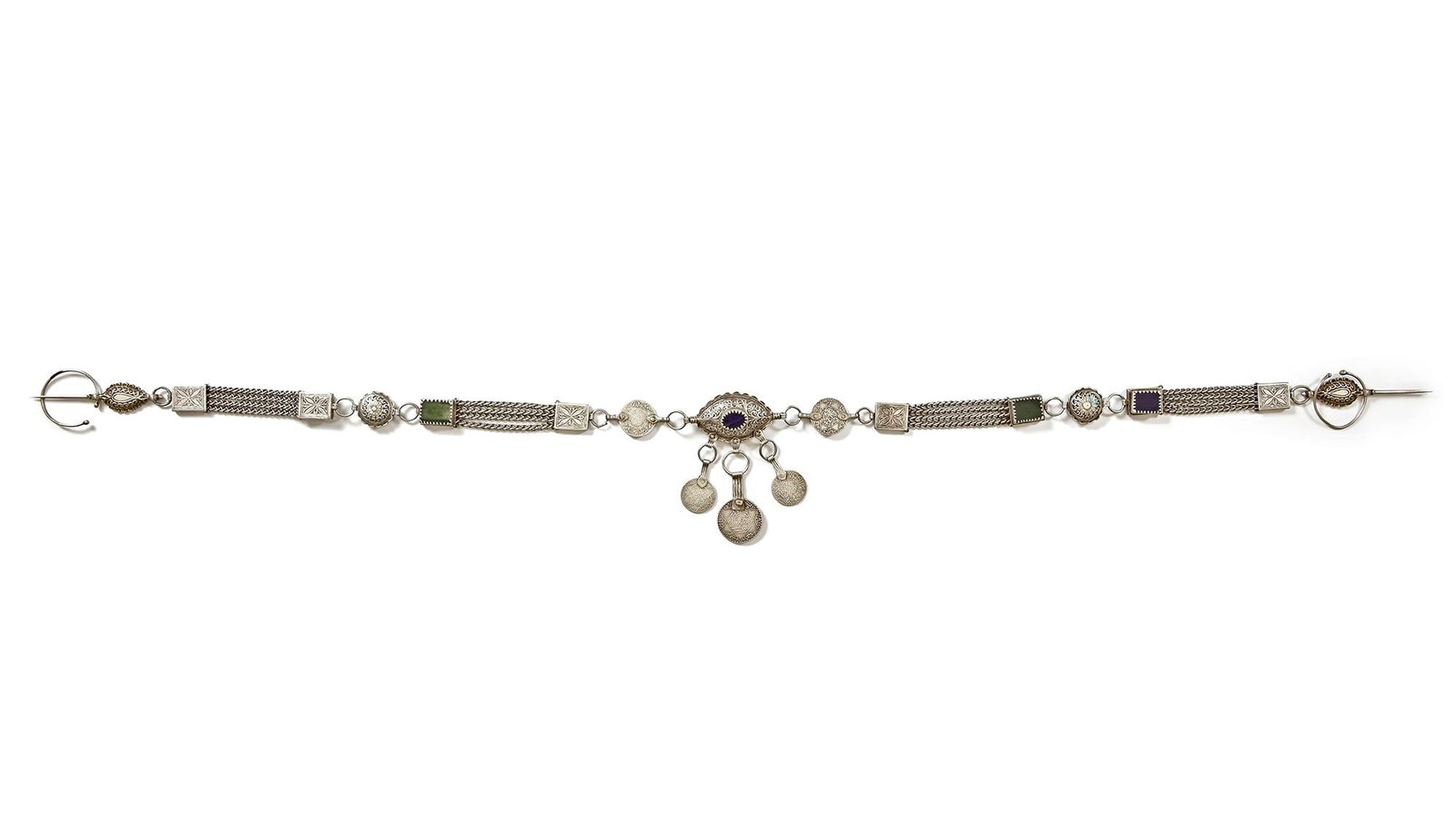 A CAUCASIAN SILVER BELT, 19TH CENTURY: Decorated with engraved medallions, colorful stone inlays, and hanging coin charms. The central clasp features intricate filigree work surrounding a gemstone. 97 cm. 267 gr. THE DR. SAAD AL-JADIR COLL