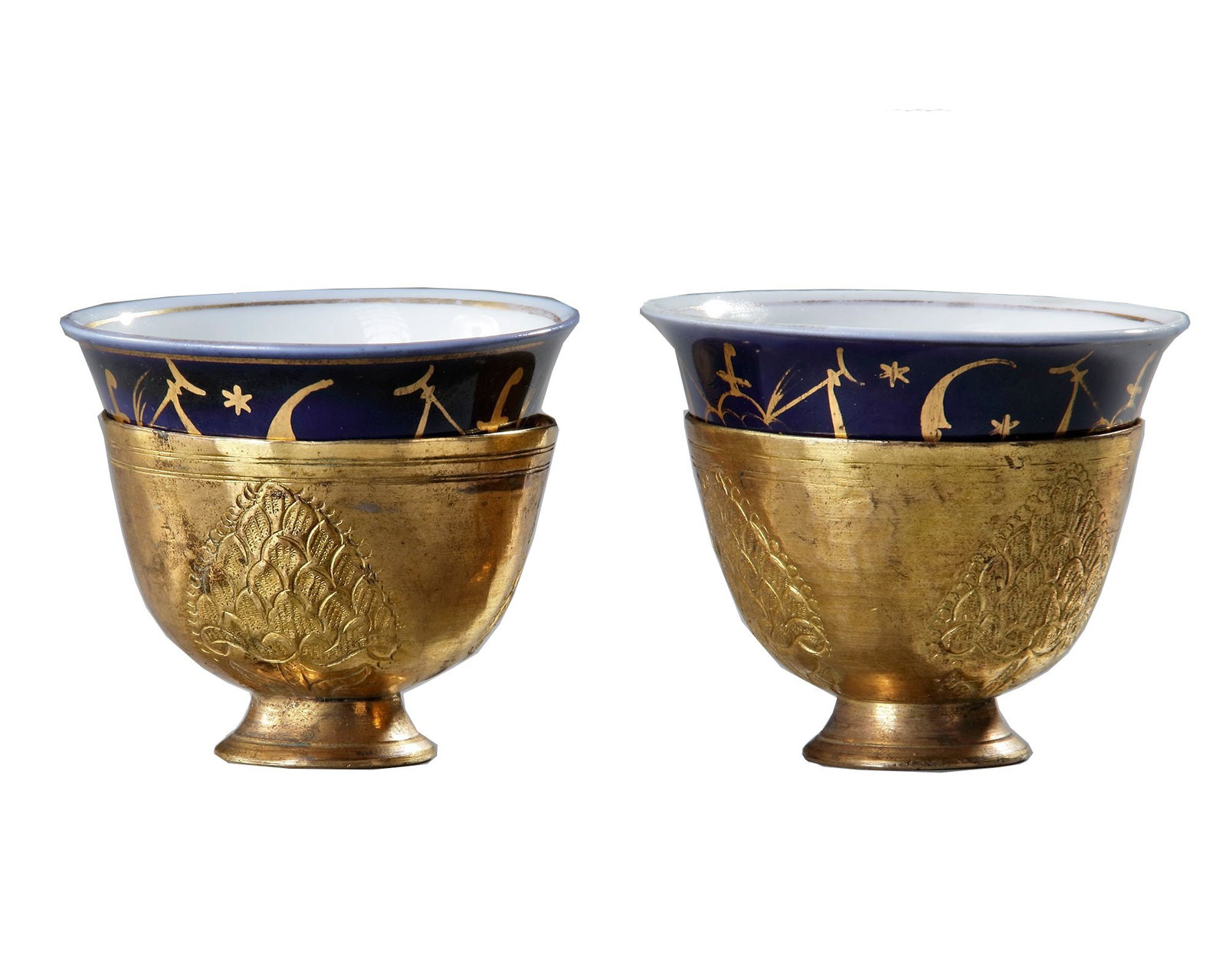 TWO OTTOMAN GILDED TOMBAK ZARF HOLDERS, WITH ORIGINAL PORCELAIN ZARFS, 18TH CENTURY (1 of 4)