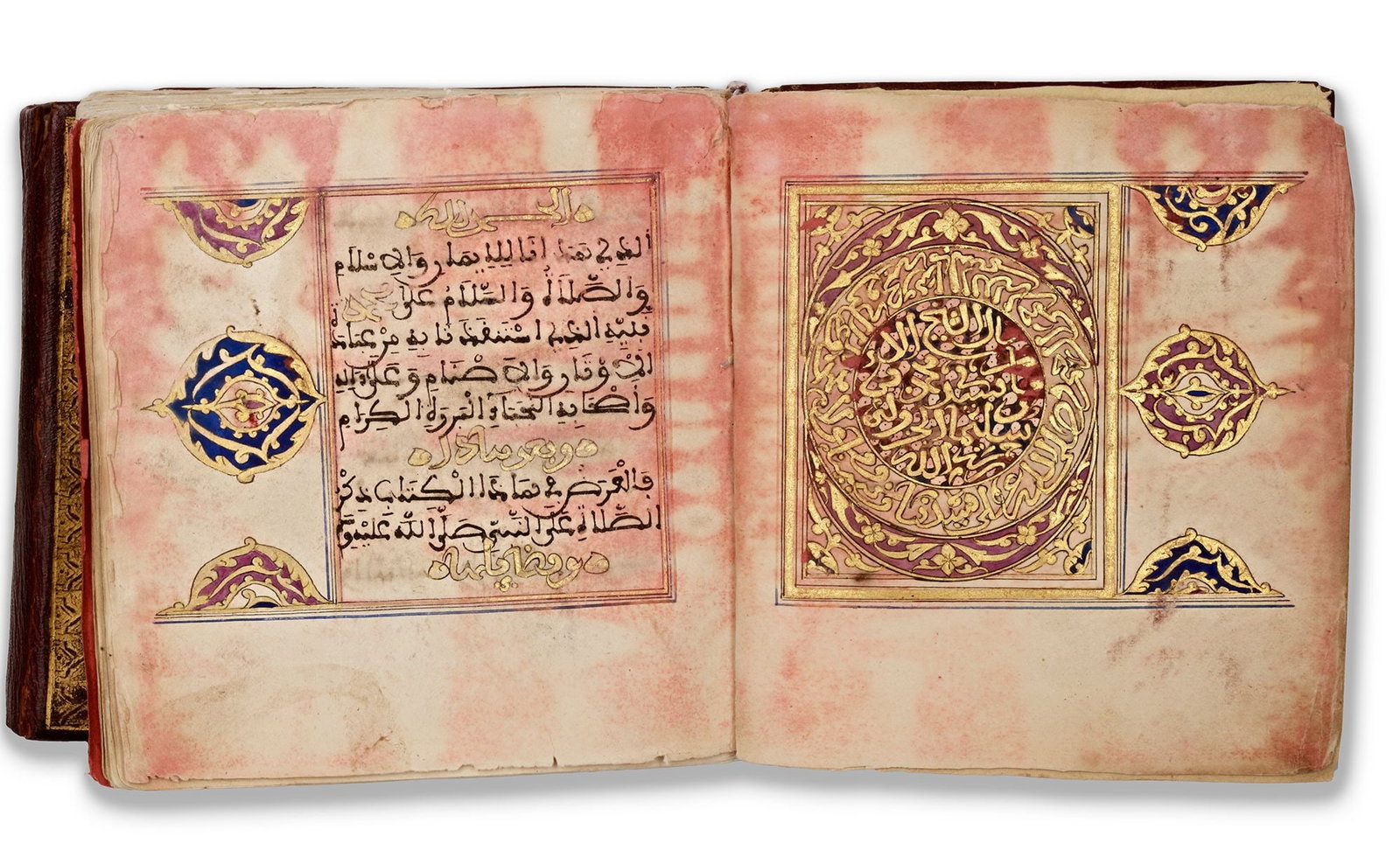MUHAMMAD BIN SULAYMAN AL-JAZULI (D.1465 AD) DALA'IL AL-KHAYRAT, 18TH CENTURY: Al-Jazuli's renowned work in praise of the Prophet Muhammad, Arabic manuscript on paper, each folio with 10 lines written in bold sepia Maghribi, titles in bold gold and polychrome Maghribi within ill