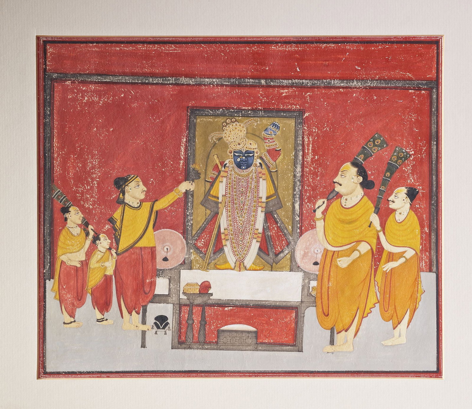 SHRINATH Ji DARSHAN, NATHDWARE , RAJASTHAN,INDIA ,Cica 19TH CENTURY: Water colour on paper Nathdwara school painting depicting the darshan of Shrinathji The dark-faced deity (a form of Krishna) stands adorned in elaborate jewelry and headdress within a golden shrine, f