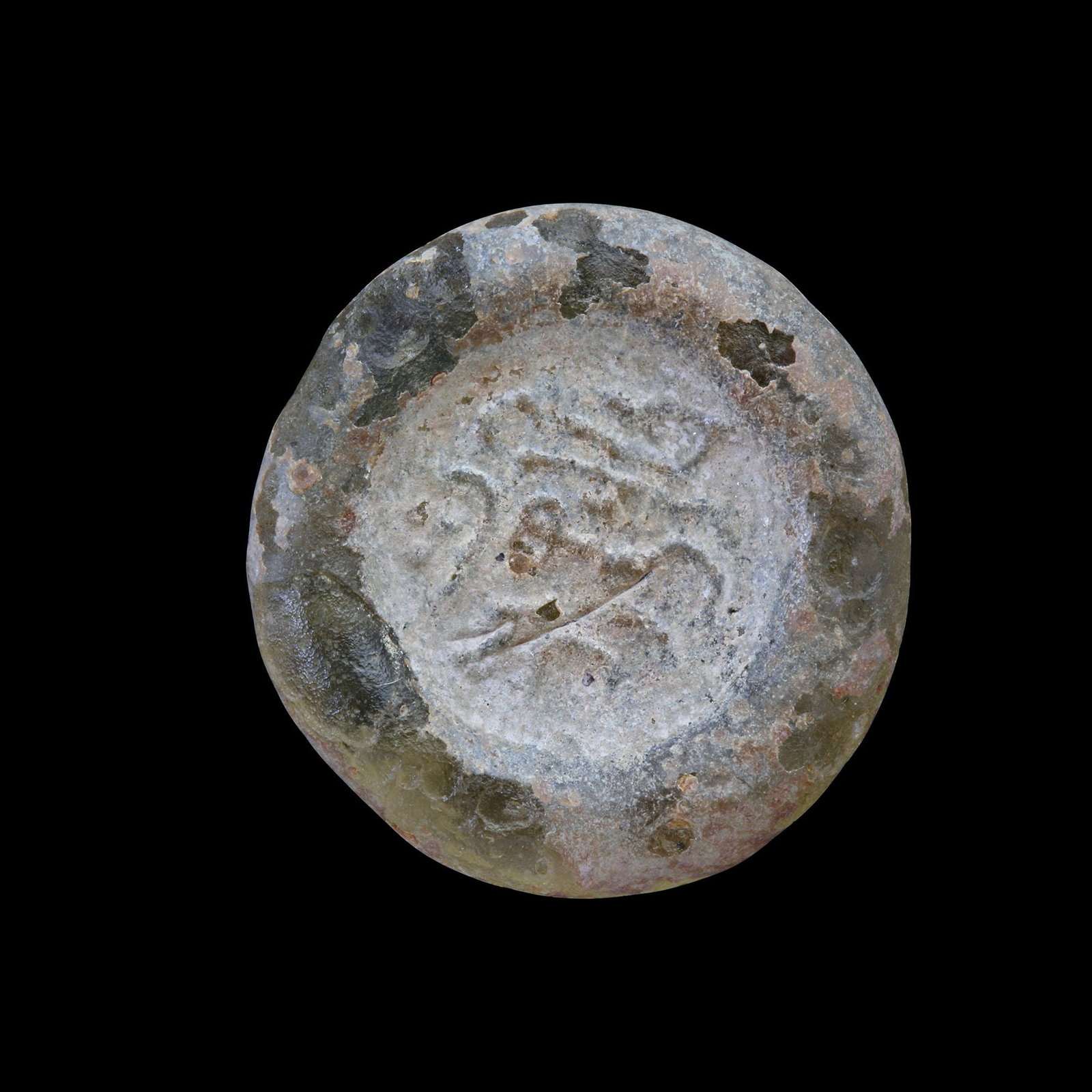 AN EARLY ISLAMIC GLASS WEIGHT OF DOUBLE DIRHAM, 10TH-11TH CENTURY: Glass weight, moulded and stamped, transparent white in colour, citing in the centre with the name" Muhammed Bin Shahin". 5.897g, 24 mm. coin weight: double dirham. N 154 PROVENANCE Ex-collection of E