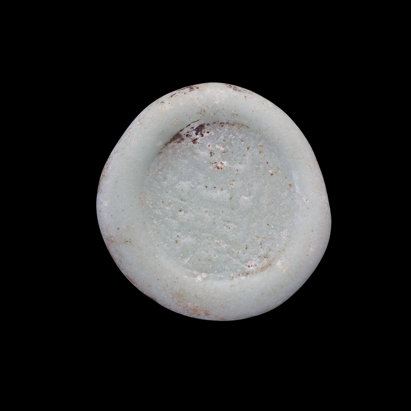 AN ABBASID GLASS WEIGHT OF DOUBLE DIRHAM, BAGHDAD AL-NASIR LI-DIN ALLAH, 576-622 AH/1180-1225 AD (1 of 2)