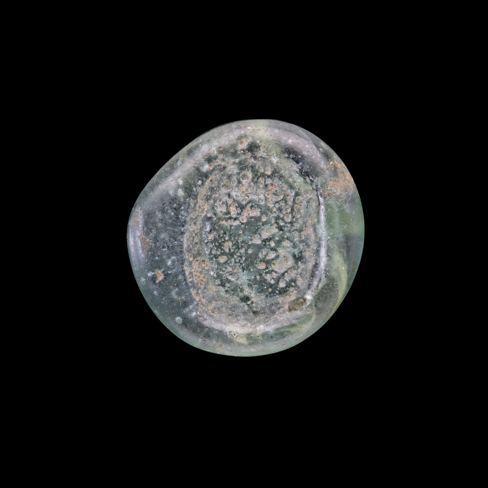 AN EARLY ISLAMIC GLASS WEIGHT OF HALF DINAR (1 of 2)