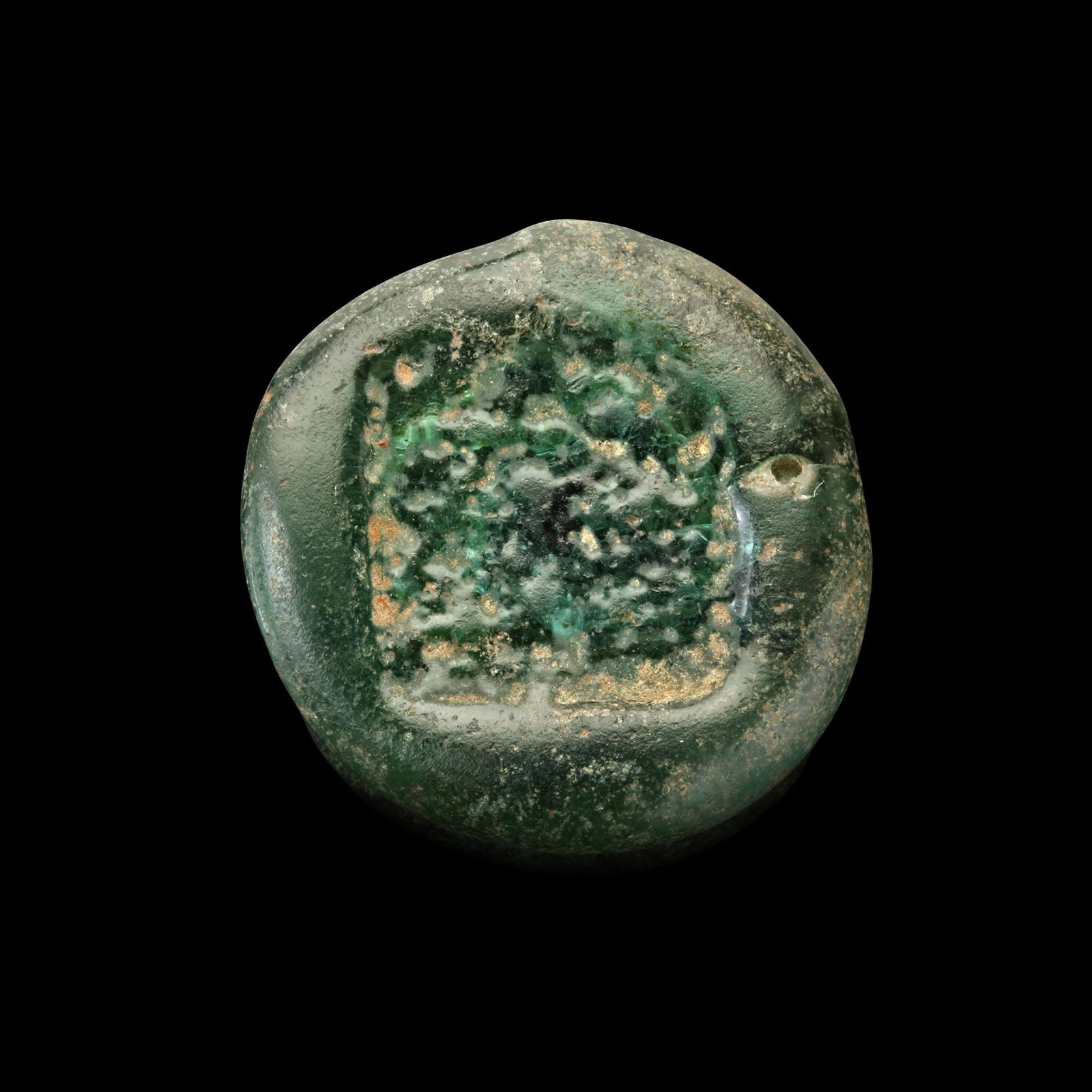 AN EARLY ISLAMIC GLASS WEIGHT OF DOUBLE DIRHAM, 10TH-11TH CENTURY: Glass weight, moulded and stamped, transparent light-green in colour, citing in the centre with 3 lines of undeciphered Arabic text. 5.849g, 21 mm. coin weight: double dirham.
