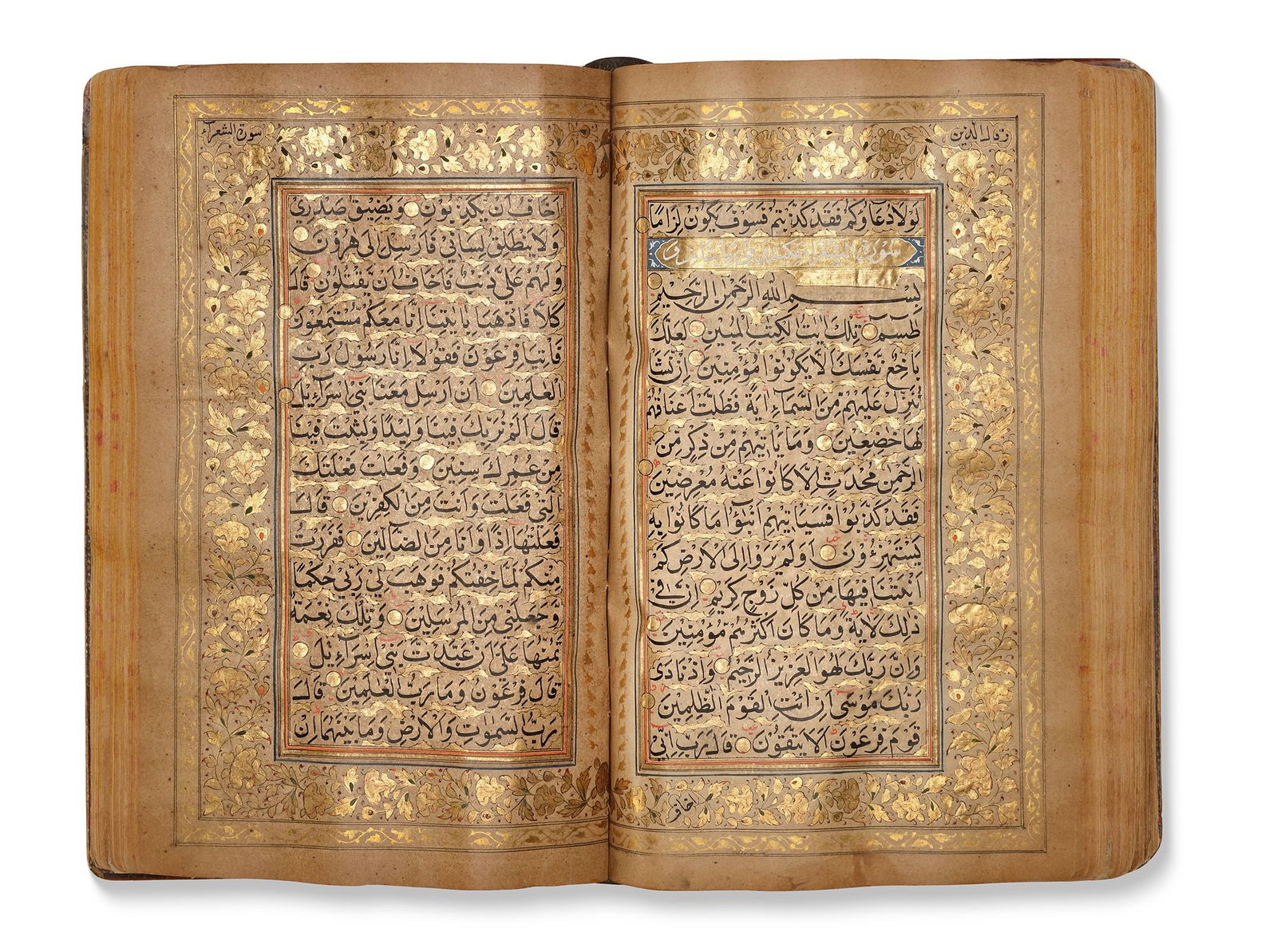 AN EARLY QAJAR QURAN, PERSIA, EARLY 18TH CENTURY: Arabic manuscript on cream paper, each page with 15 lines written in black naskh script, tajwid in red ink, ruled in double gold and blue borders, gold roundel verse markers outlined in black, each pa