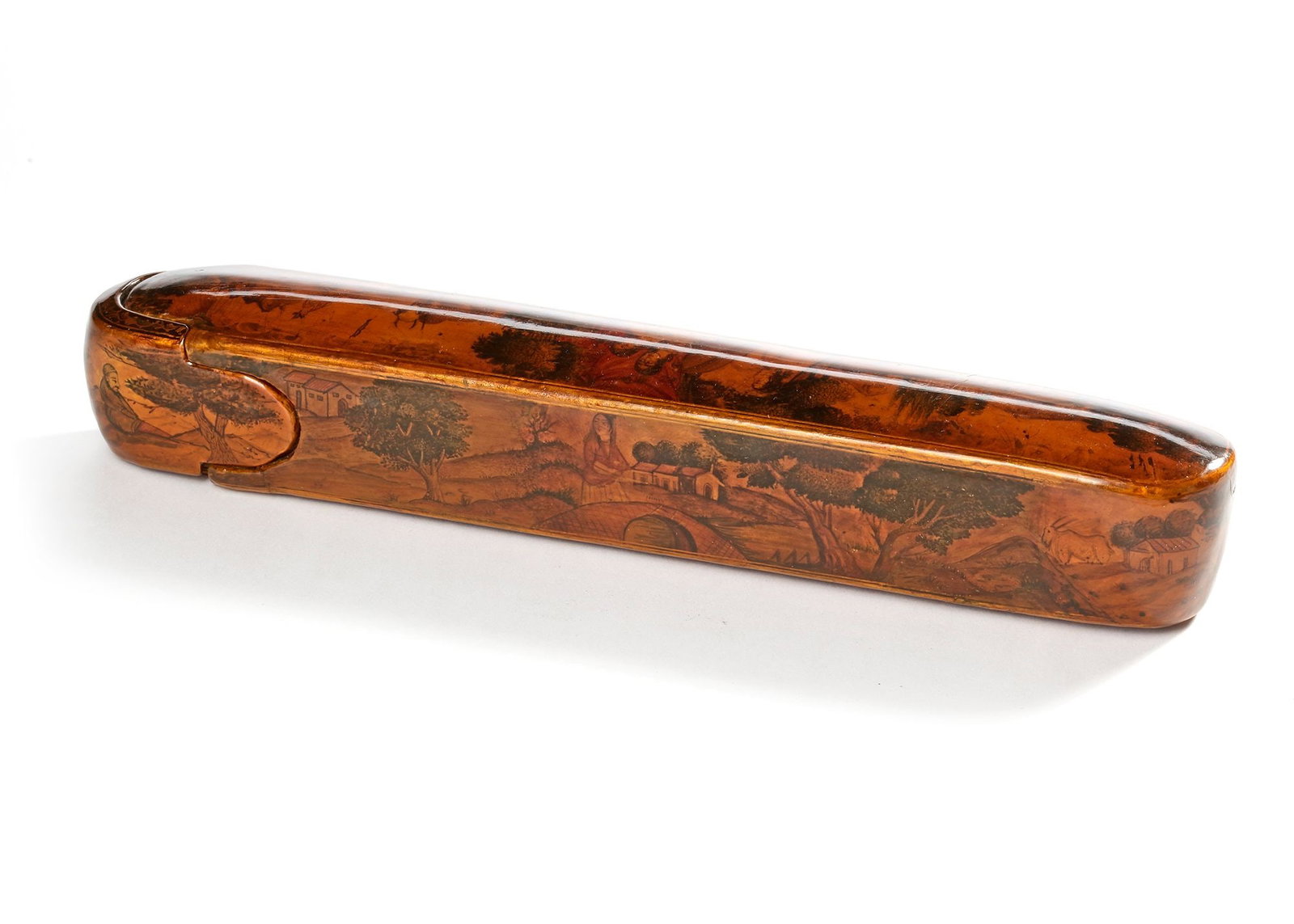 A QAJAR LACQUERED PAPIER-MACH?‰ PEN CASE (QALAMDAN), 19TH CENTURY: Of elongated oval form with sliding drawer, decorated in gilt and polychrome, the top and the sides depicting Qajar figures with animals in a landscape, the sides with castles in the background, the u
