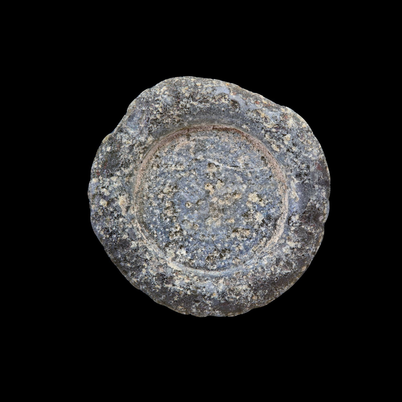 AN EARLY ISLAMIC GLASS WEIGHT OF DOUBLE DIRHAM, 10TH-11TH CENTURY: Glass weight, moulded and stamped, transparent light-green in colour, citing in the centre with 2 lines of undeciphered Arabic text. 5.377g, 27 mm. coin weight: double dirham.