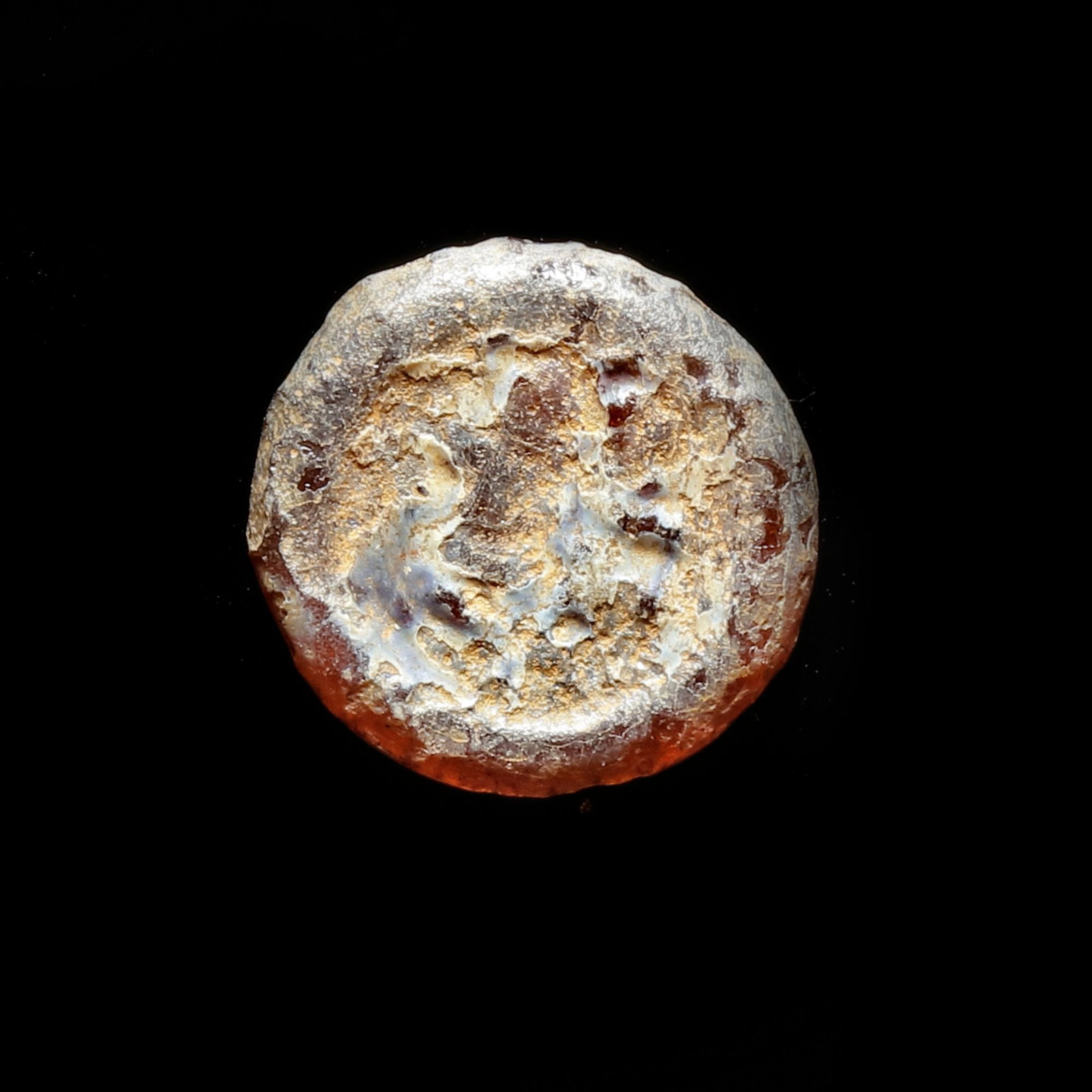 AN EARLY ISLAMIC GLASS WEIGHT OF HALF DIRHAM (1 of 2)
