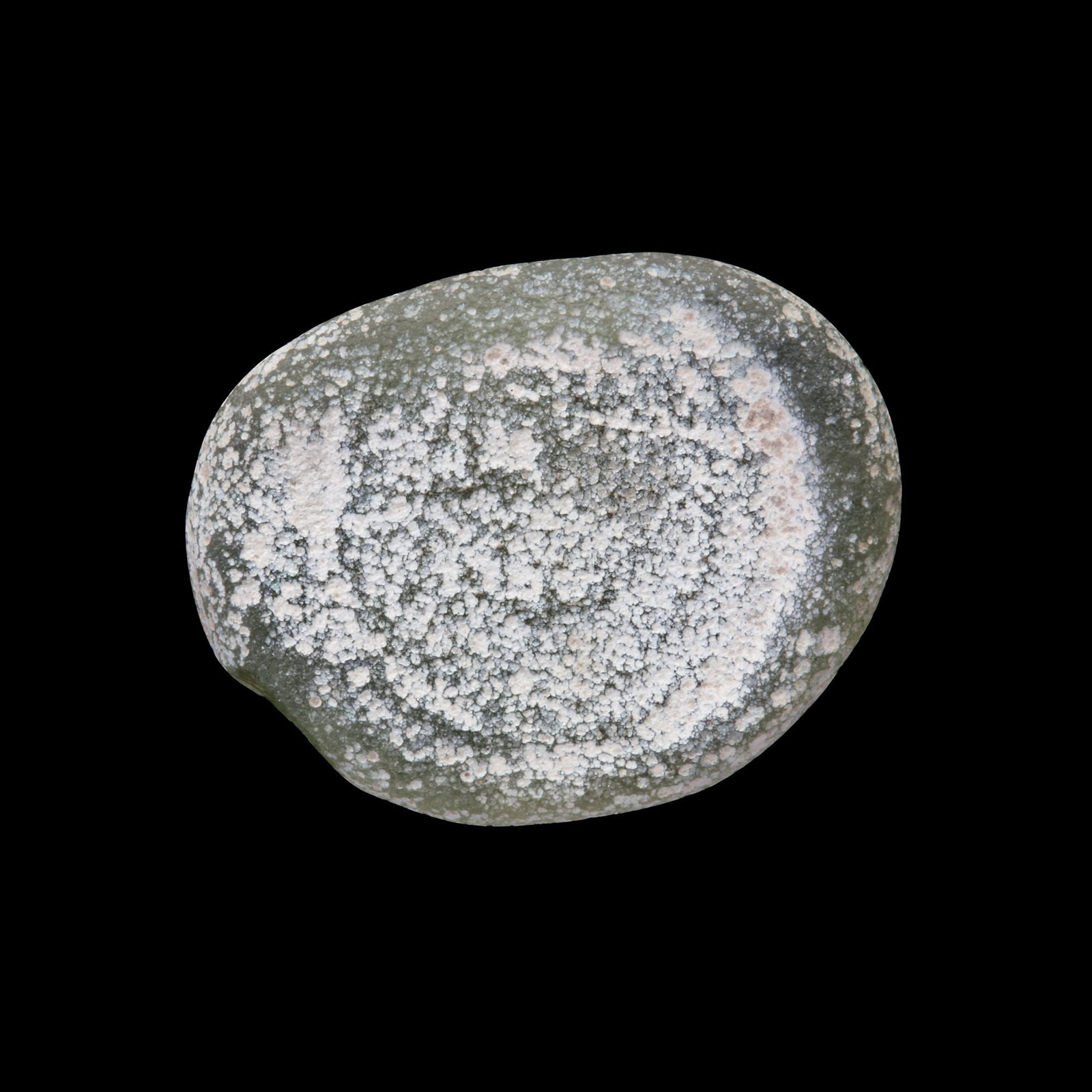 AN EARLY ISLAMIC GLASS WEIGHT OF THREE QUARTER DIRHAM: Glass weight, moulded and stamped, transparent pale-green in colour, citing in the centre with the name Amir Ma'ad (427-487 AH/1036-1094 AD). 1.960 g., 15 by 20 mm. coin weight: 3/4 dirham.