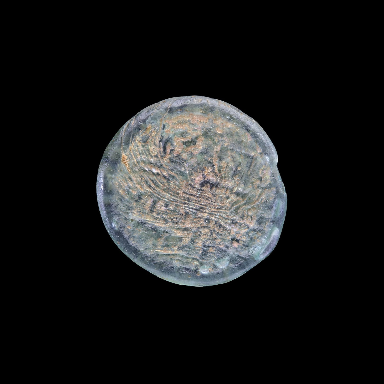 AN EARLY ISLAMIC GLASS WEIGHT OF HALF DIRHAM, 10TH-11TH CENTURY: Glass weight, moulded and stamped, transparent light-green in colour, citing in the centre with 3 lines of undeciphered Arabic text. 1.664g, 19 mm. coin weight: half dirham.