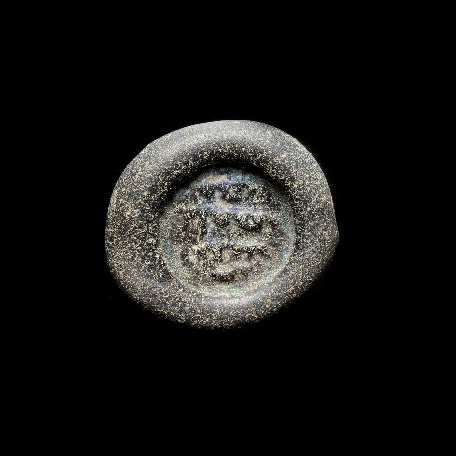 AN ABBASID GLASS WEIGHT OF DOUBLE DIRHAM, BAGHDAD AL-NASIR LI-DIN ALLAH, 576-622 AH/1180-1225 AD (1 of 3)