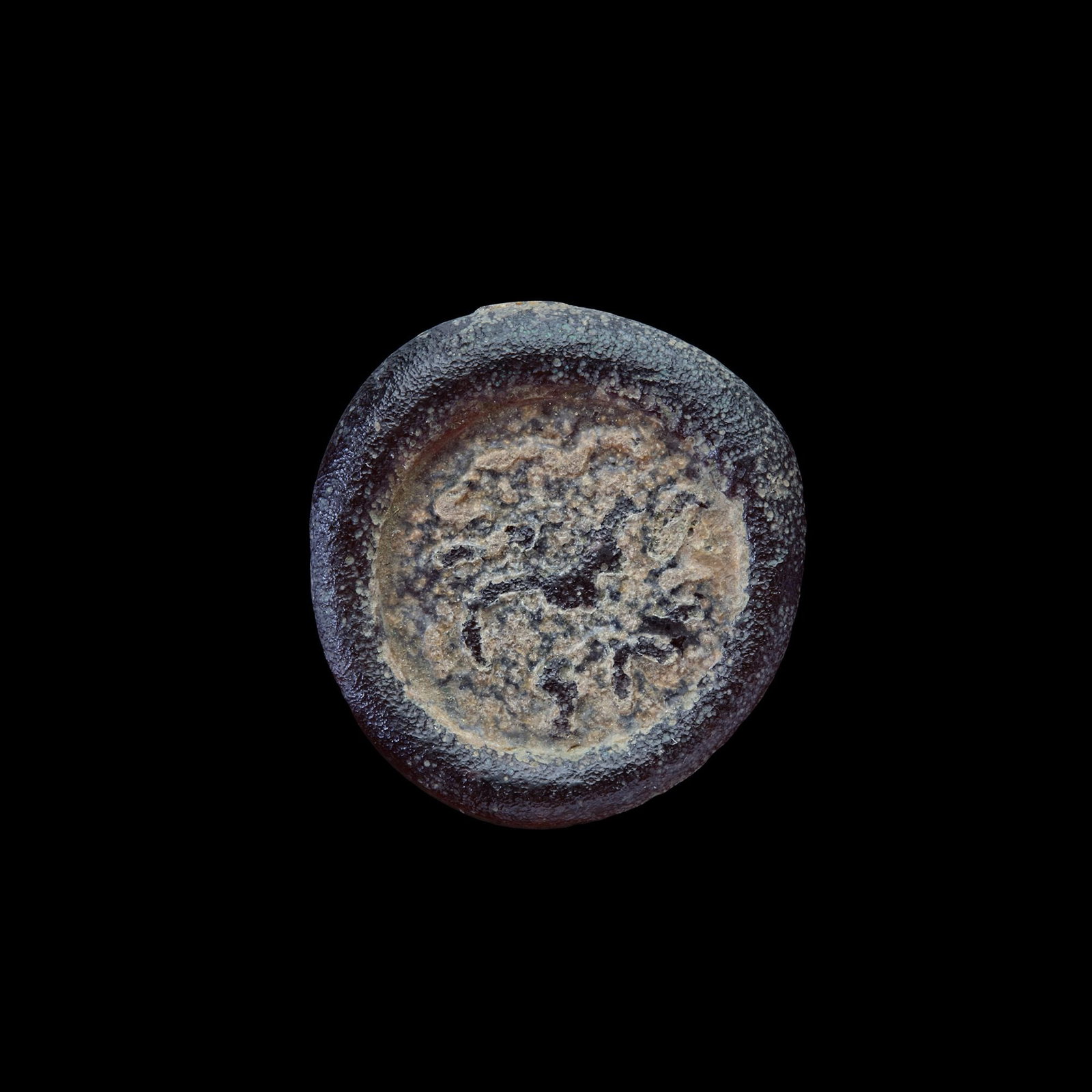 AN EARLY ISLAMIC GLASS WEIGHT OF DIRHAM, 10TH-11TH CENTURY: Glass weight, moulded and stamped, transparent violet in colour, citing in the centre with" Muhammed Al-Audi the year 50 and". 2.630 g., 21 mm. coin weight: dirham. LP 347-N 155