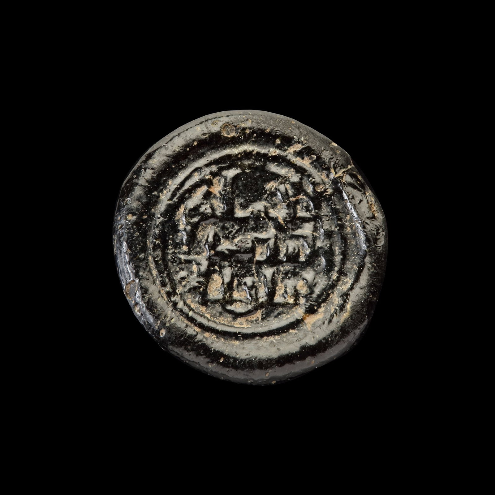 AN EARLY ISLAMIC GLASS WEIGHT OF DIRHAM (1 of 2)