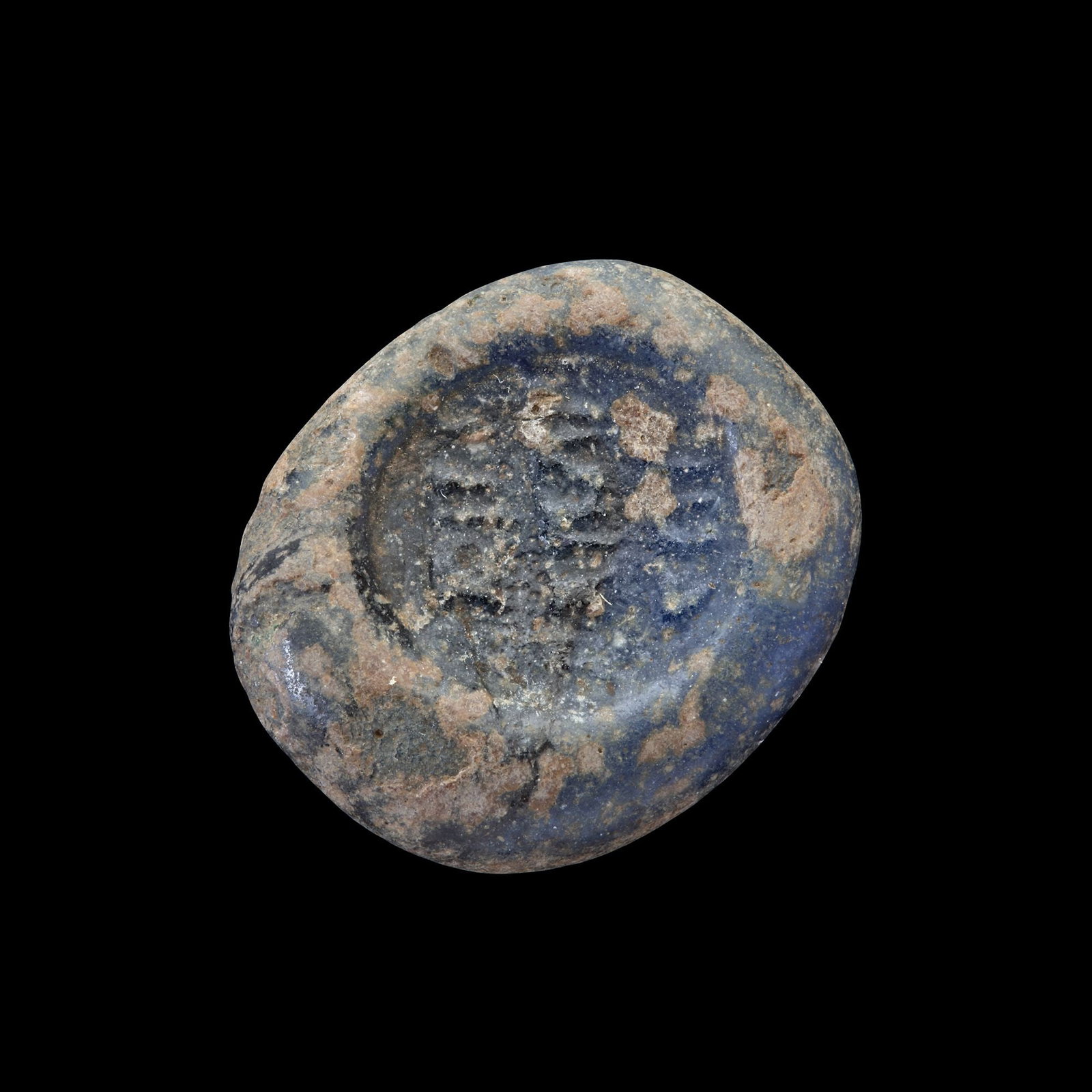 AN EARLY ISLAMIC GLASS WEIGHT OF DOUBLE DIRHAM, 10TH-11TH CENTURY: Glass weight, moulded and stamped, opaque dark-green in colour, citing in the centre with 3 lines of undeciphered Arabic text. 5.703 g., 25 mm. coin weight: double dirham.
