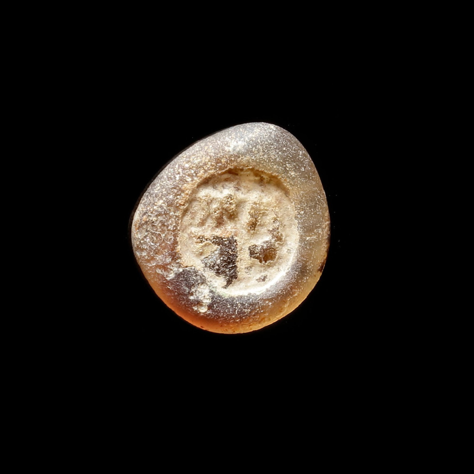 AN EARLY ISLAMIC GLASS WEIGHT OF HALF DIRHAM (1 of 3)