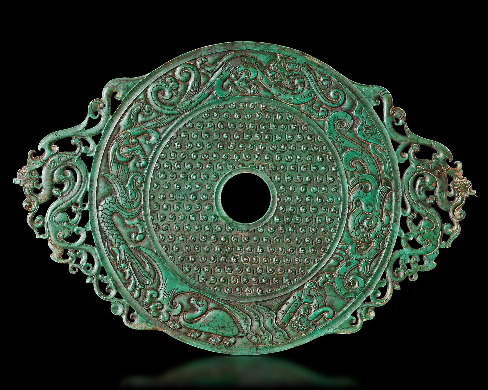 A CHINESE GREEN DRAGONâ€“PHOENIX BI DISC, HAN DYNASTY (206 BCâ€“220 AD) (1 of 4)