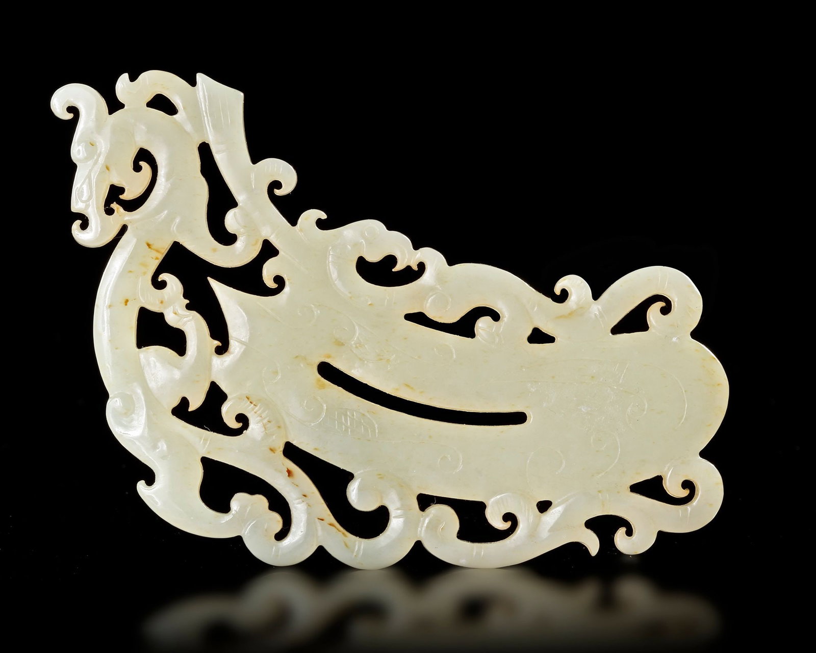 A WHITE JADE SHIELD-SHAPED PENDANT, HAN DYNASTY (206 BCâ€“220 AD) (1 of 3)