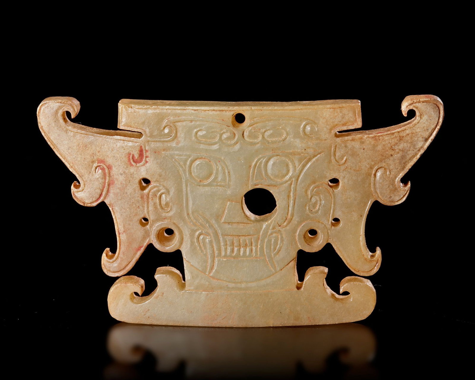 A CHINESE YELLOW JADE ANCESTOR MASK, POST SHIJIAHE CULTURE (c 2000-1800 BC) (1 of 3)