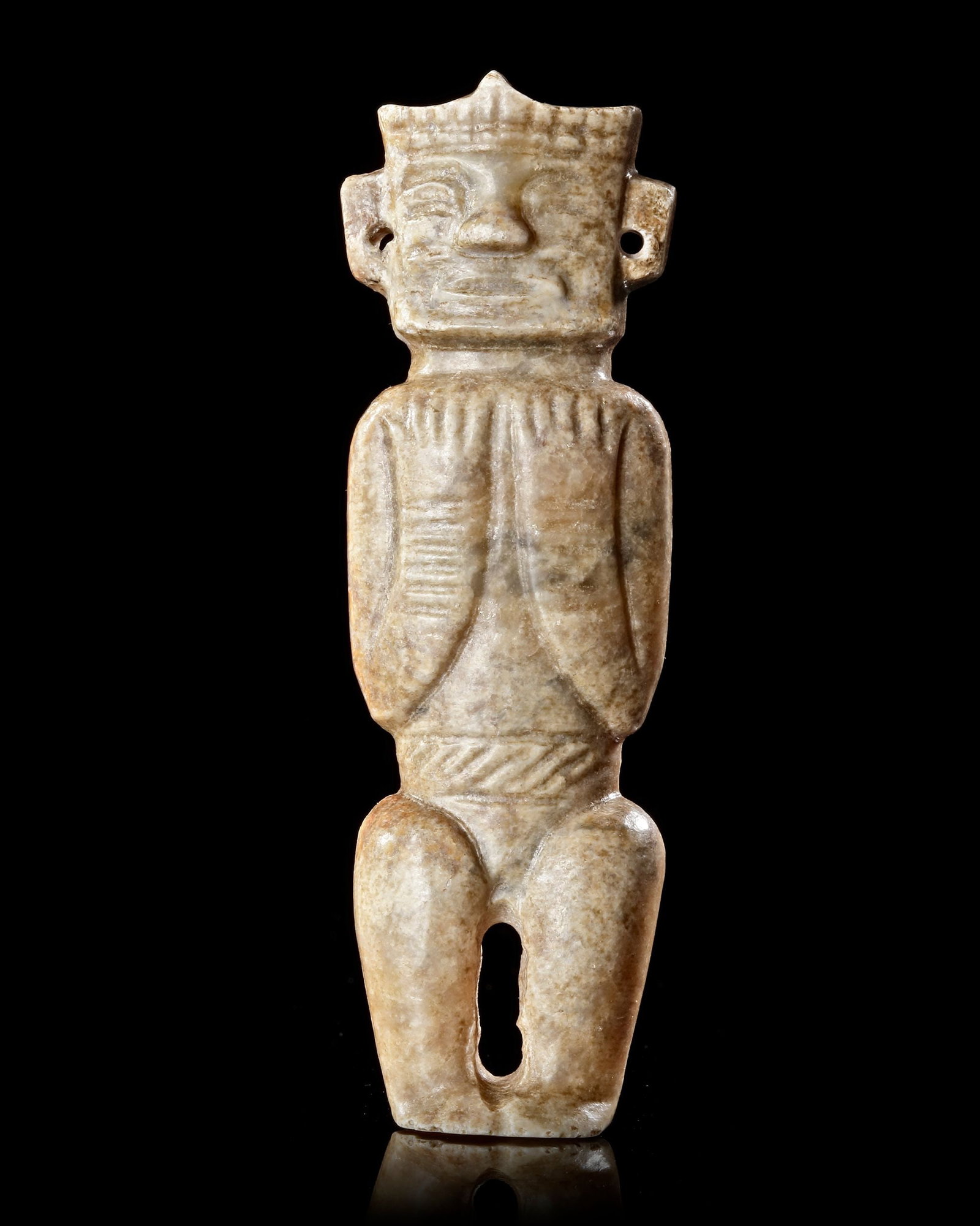 A LINGJIATAN JADE HUMAN FIGURE, CHINA, NEOLITHIC PERIOD (c. 3300â€“2600 BC): A rare creamy white jade human figure from the Lingjiatan culture, masterfully carved with a large expressive head, pierced earlobes, and folded arms resting against the chest. The figure wears a belt