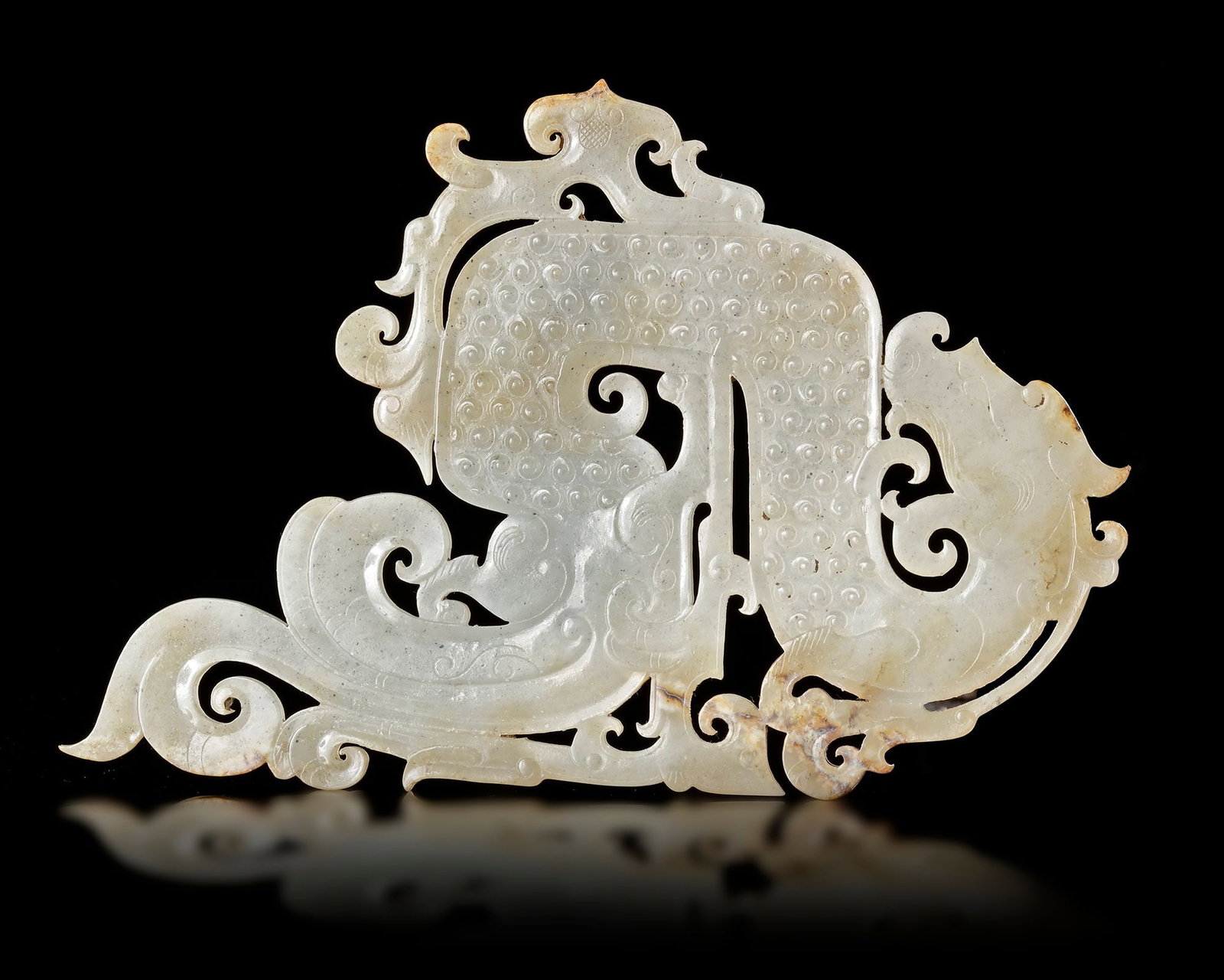A PALE CELADON JADE DRAGON PENDANT, CHINA, HAN DYNASTY (206 BCâ€“220 AD) (1 of 3)