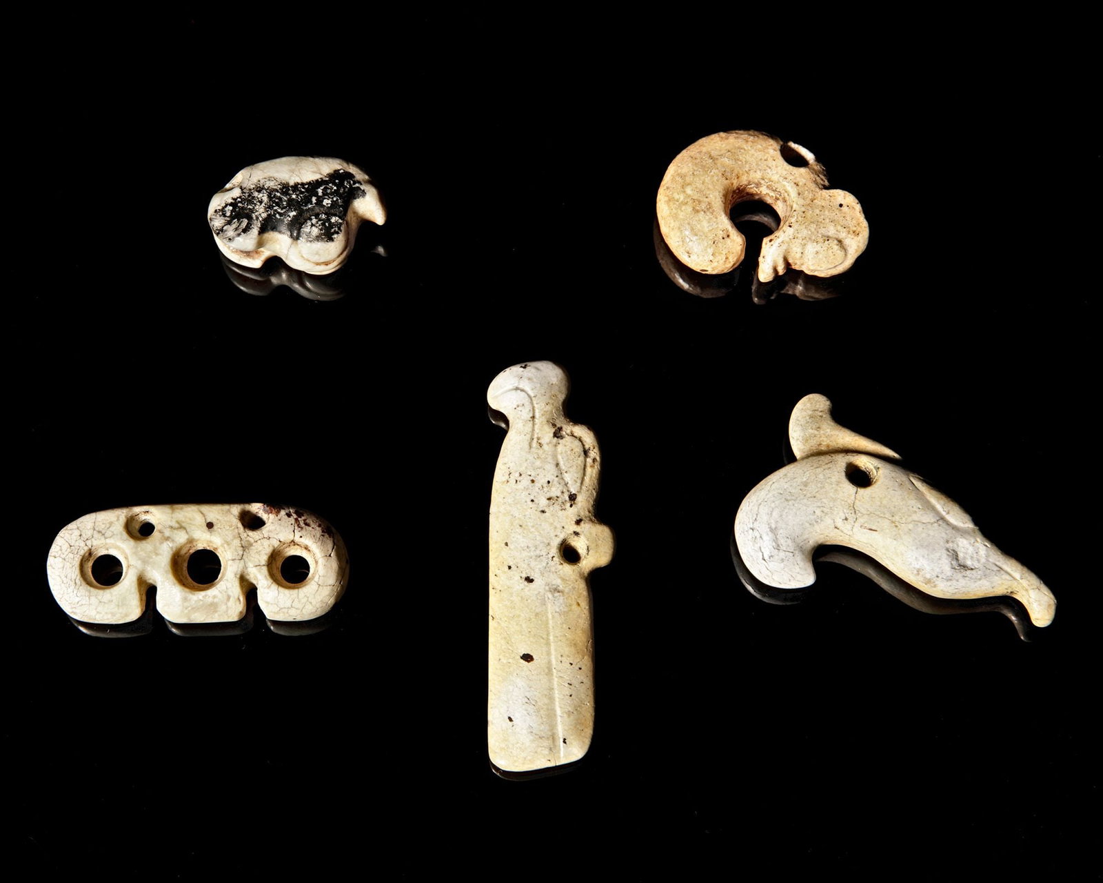 A NEOLITHIC HORN PENDANT WITH FIVE OBJECTS, CHINA (1 of 2)