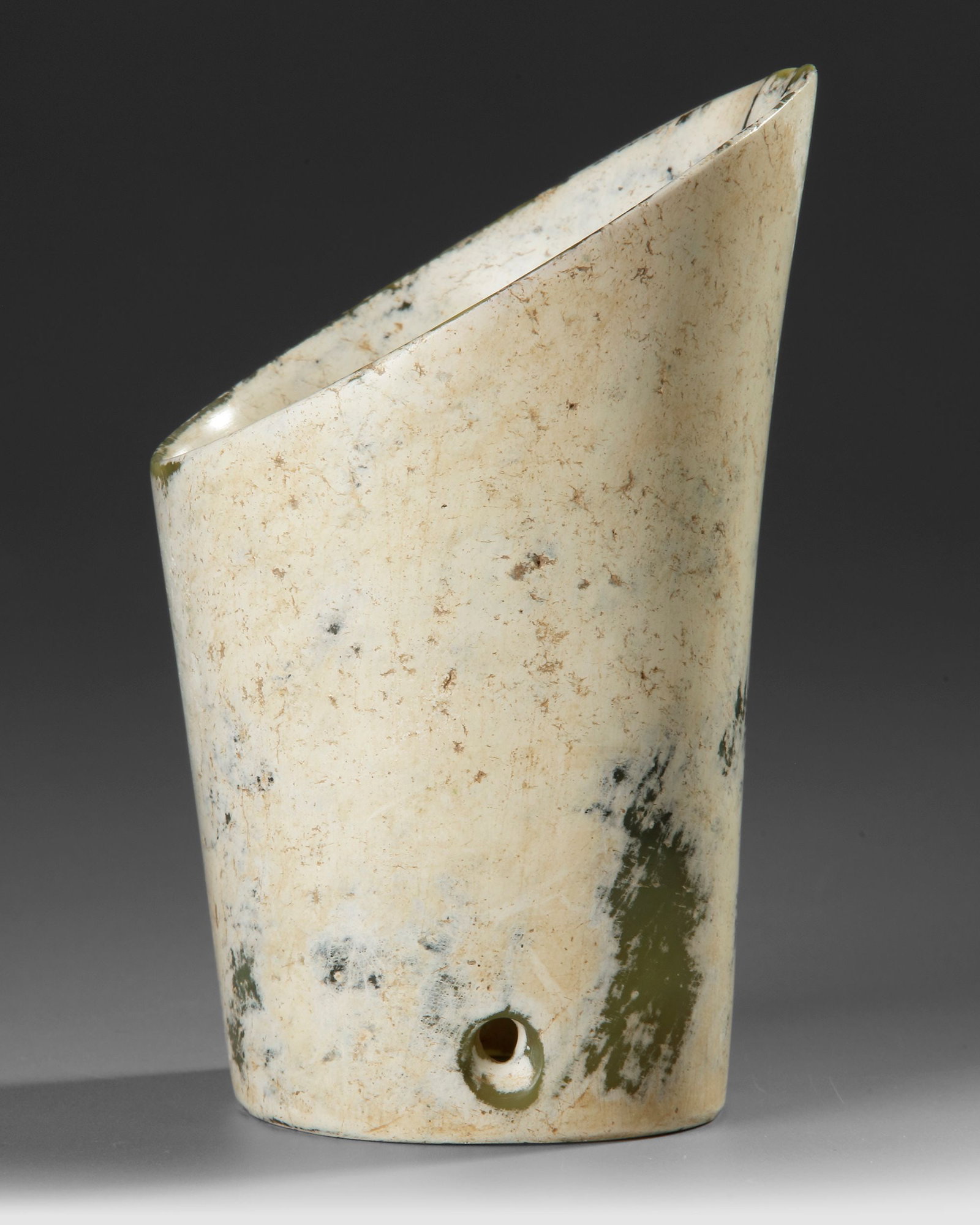 A RARE ALTERED OPAQUE BUFF JADE HOOF-SHAPED TUBULAR ORNAMENT, CHINA, NEOLITHIC PERIOD, HONGSHAN (1 of 4)
