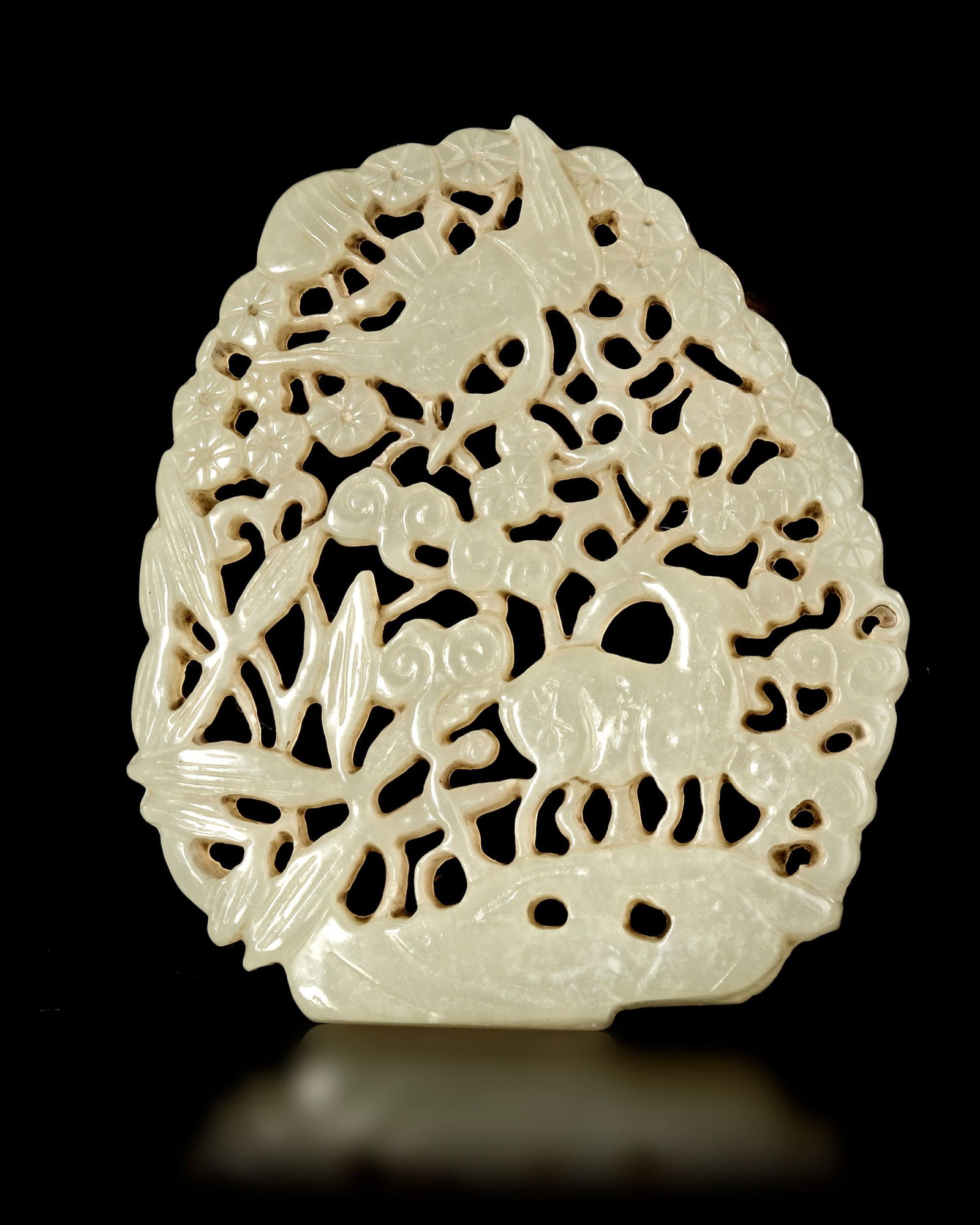 A WHITE JADE OPENWORK PENDANT, CHINA, MING DYNASTY (1368-1644) (1 of 2)