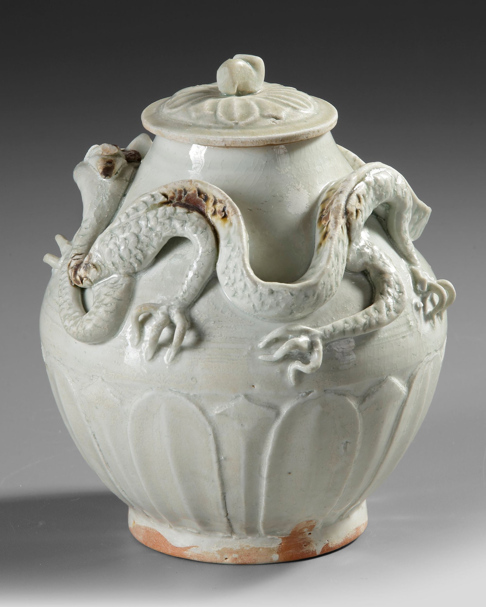 A CHINESE WHITE-GLAZED DRAGON JAR AND COVER,SONG DYNASTY (960-1279) (1 of 4)