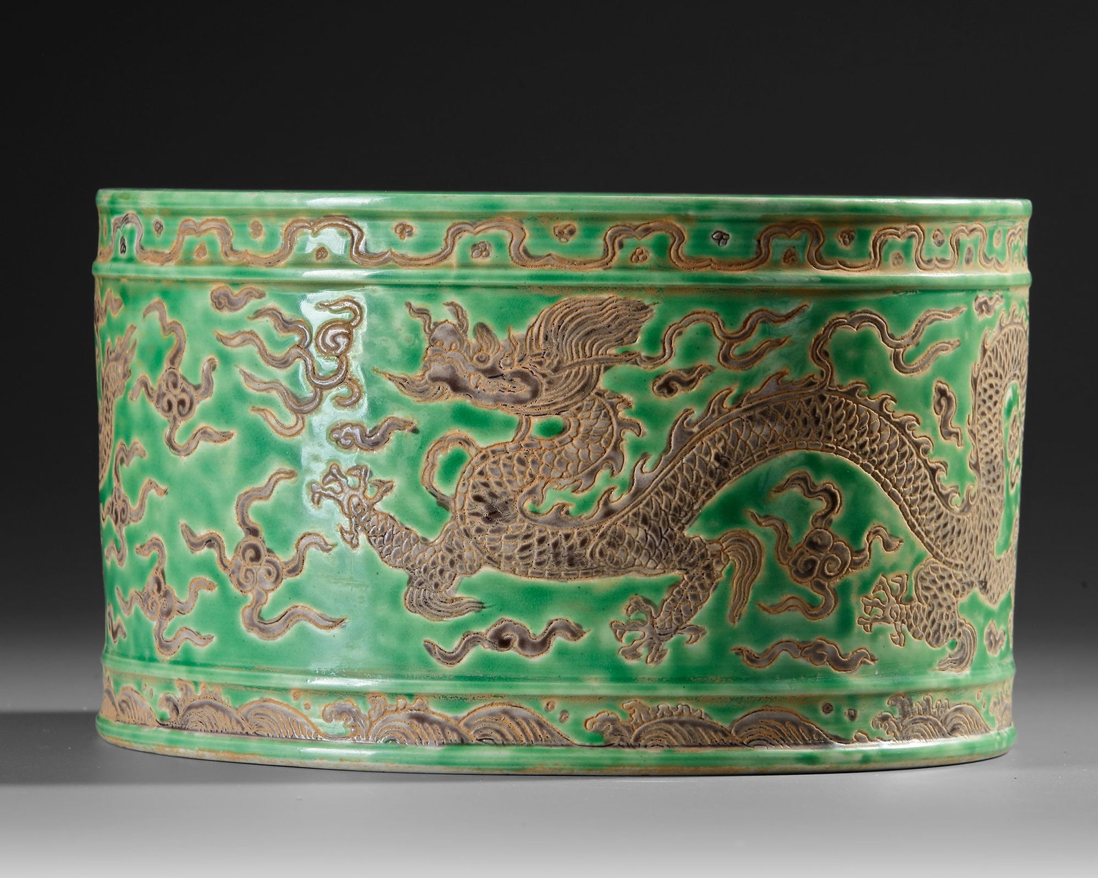 A CHINESE DRAGON-DECORATED GREEN-GROUND BRUSH POT,QING DYNASTY (1644â€“1911) (1 of 4)