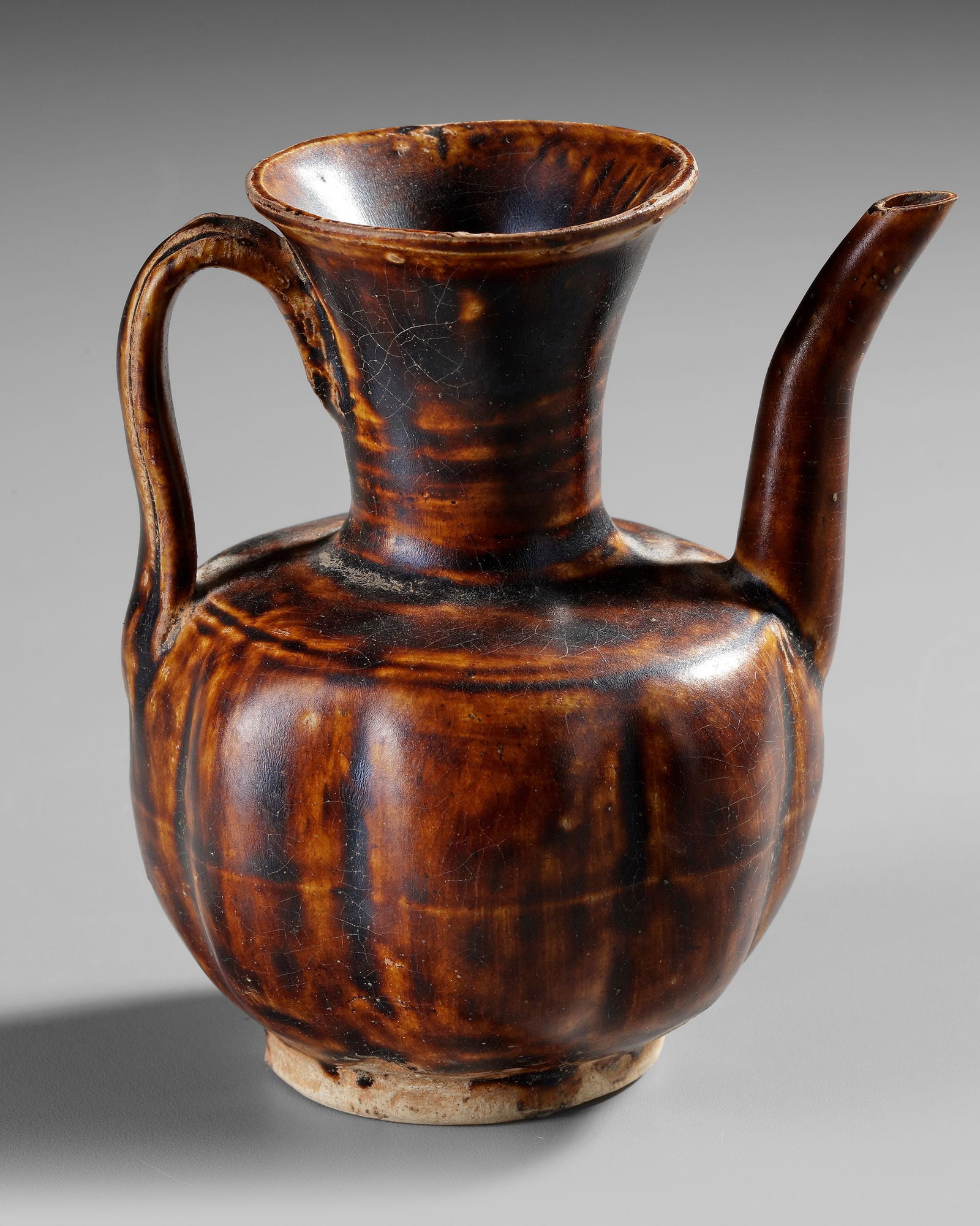 A CHINESE CIZHOU-TYPE BROWN-GLAZED EWER,SONG DYNASTY OR LATER (1 of 4)