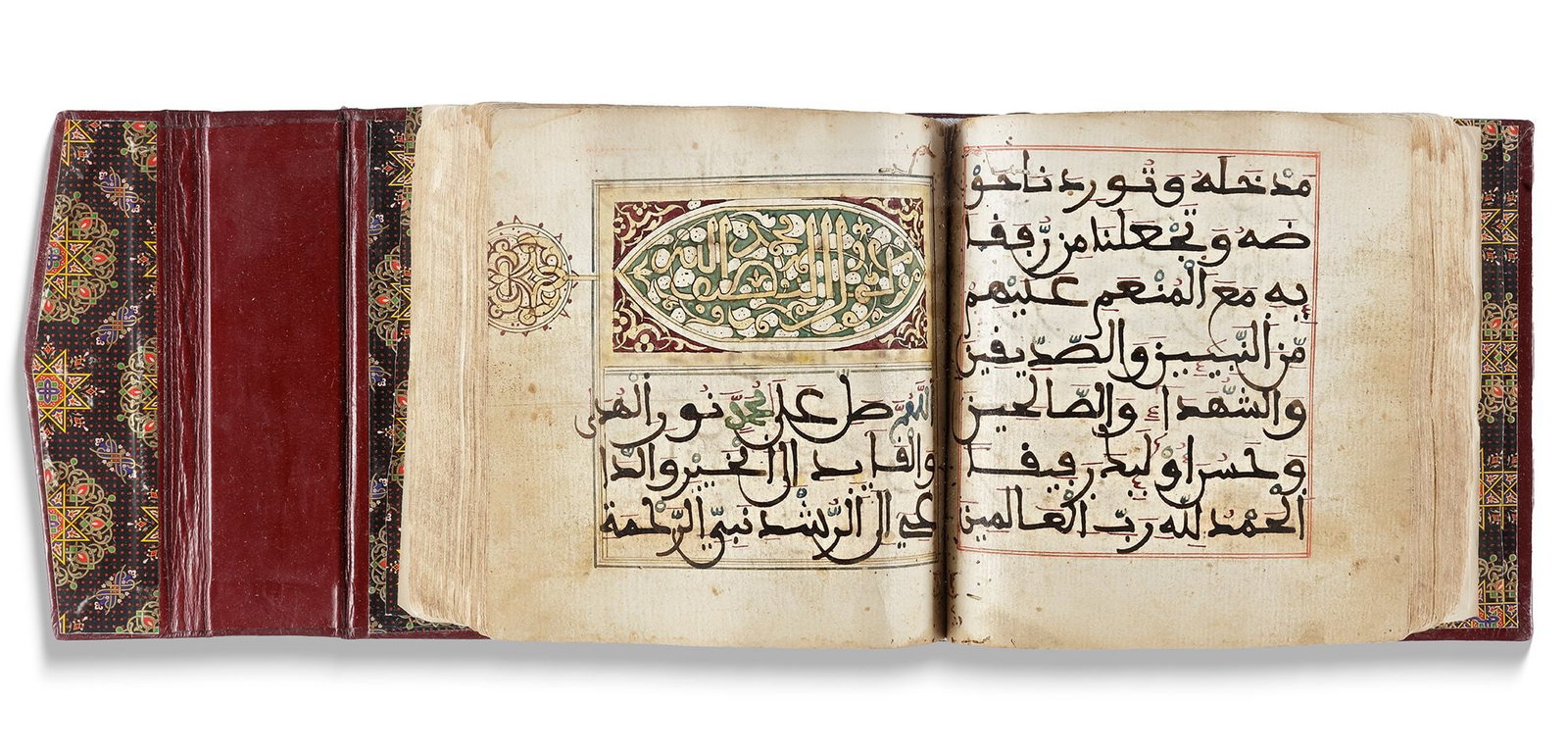 AL-JAZULI, DALA'IL AL-KHAYRAT WA SHAWARIQ AL-ANWAR, NORTH AFRICA, 18TH CENTURY: Arabic manuscript on cream-coloured paper, 7 lines to the page written in clear large maghribi script, significant words picked out in red and green, margins ruled in red ink, headings in black angula