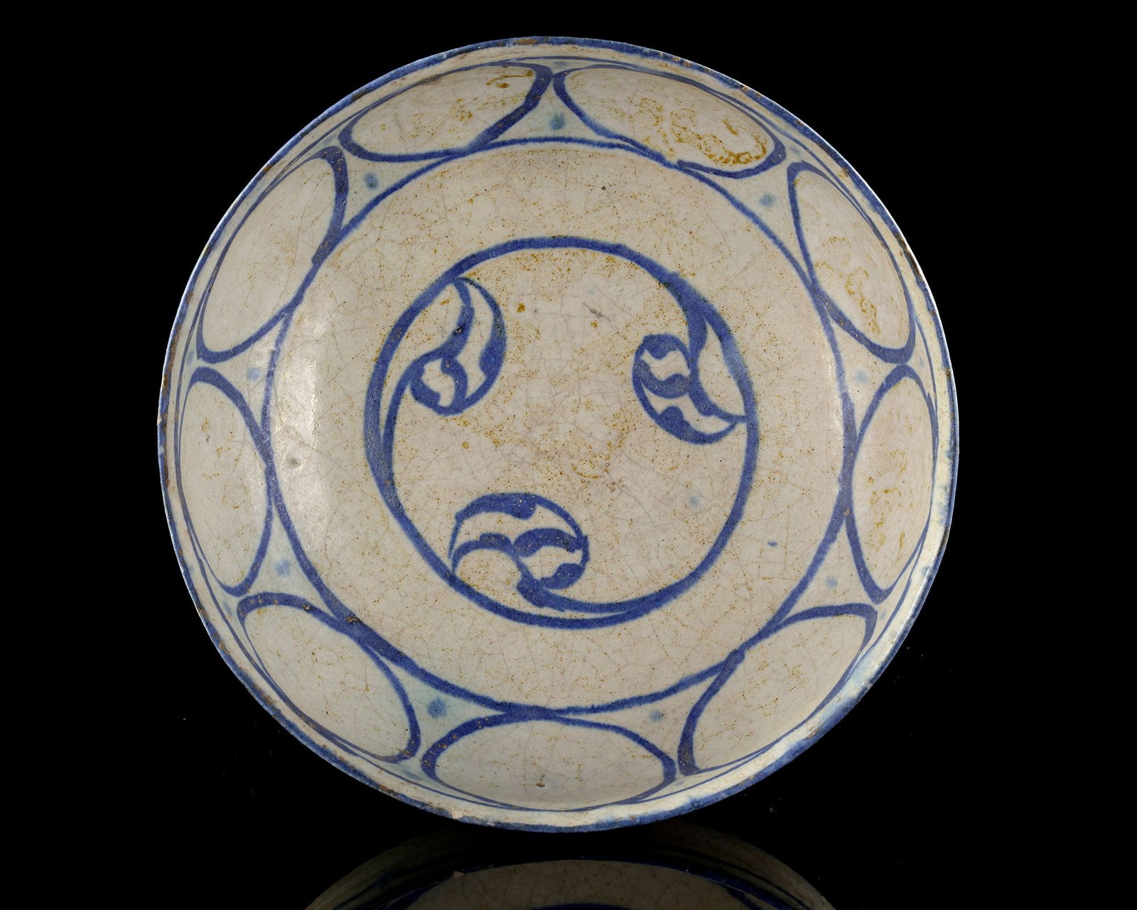 A KASHAN LUSTRE BOWL, 12TH CENTURY: Fine ceramic bowl from Kashan, Persia, dates to the 12th century and exemplifies the regionâ€™s mastery of lustreware and underglaze painting. The bowl features cobalt-blue decoration on a cre