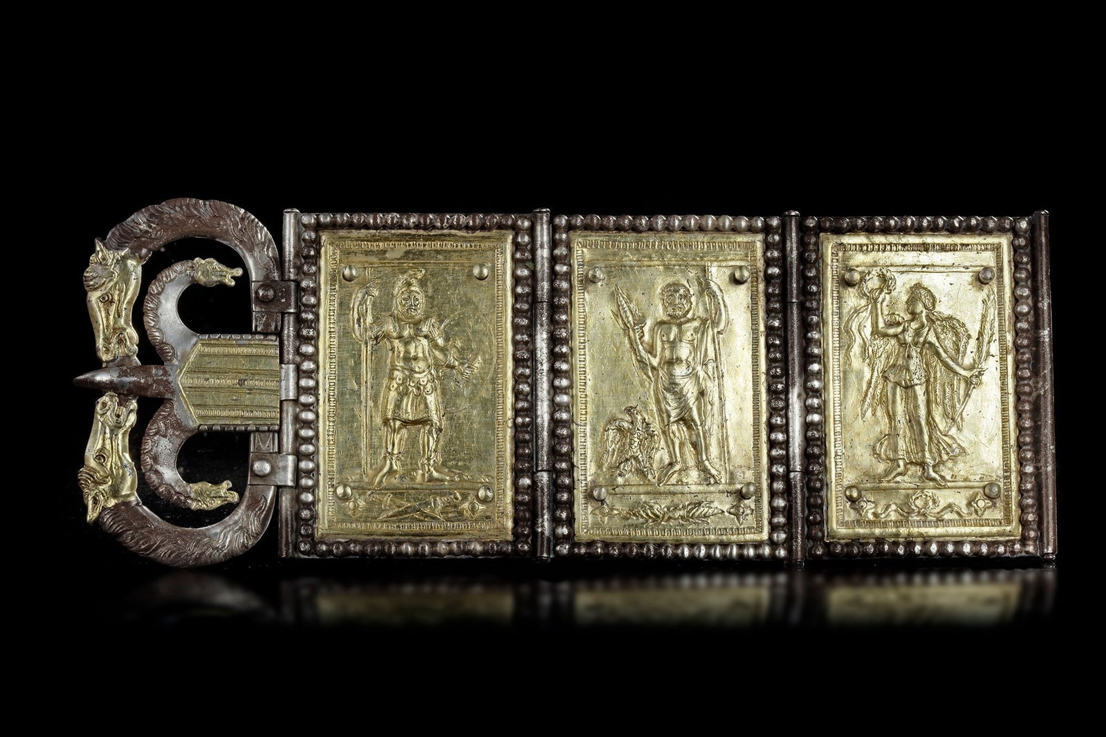 AN EXCEPTIONAL LATE ROMAN SILVER PARADE BELT FITTING WITH SILVER PARTIALLY GILT, LATE 4TH CENTURY AD: Made of multiple elements of silver sheet, strips, beaded wire and rods: hammered, cut, chiselled, punched, grooved, folded, chased and repouss?©. Certain parts mercury-gilt: the plates, loop and ton