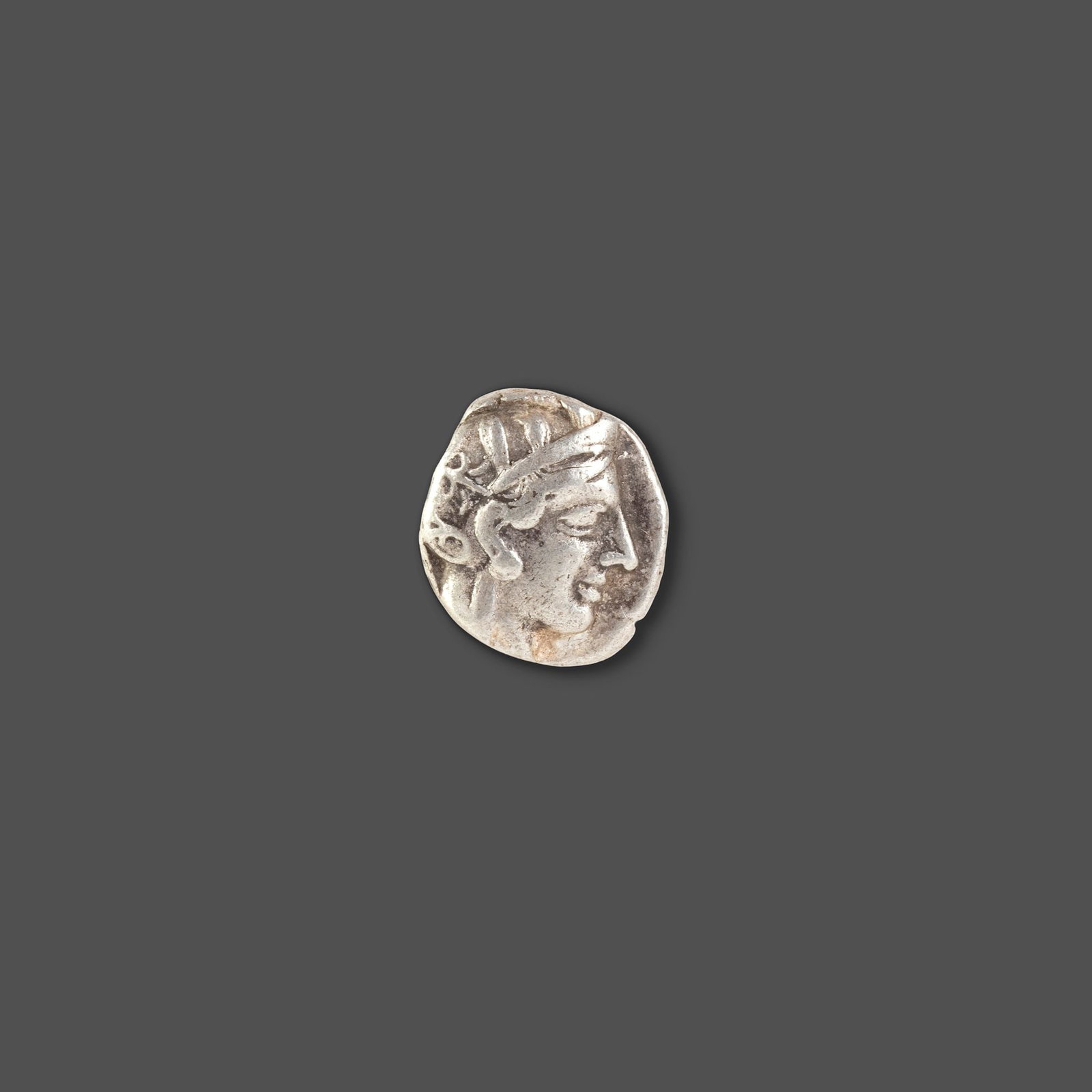 ATHENIAN SILVER TETRADRACHM ATTICA, ATHENS, CIRCA 465â€“454 BC: A classic ancient Athenian silver tetradrachm featuring the helmeted head of Athena on the obverse and the iconic owl of Athens on the reverse, accompanied by an olive sprig and crescent. Struck durin