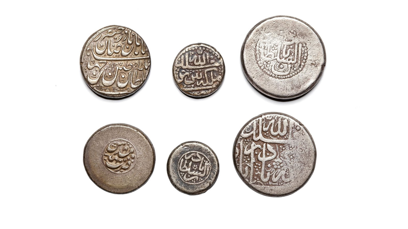 AFSHARID, TEMP. NADER SHAH AFSHAR(1148â€“1160AH/ 1736â€“1747AD), THREE SILVER COINS, DATED: A silver double Rupee, Nadirabad mint, not dated, 22.5g, 26mm. A silver 6 Shahi, Tabriz mint, not dated, 6.9g, 17mm. A silver Rupee, Mashhad mint, not dated, 11.3g, 22mm.
