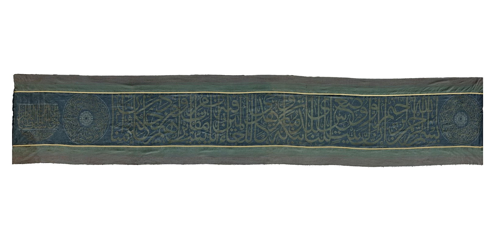 AN OTTOMAN CALLIGRAPHIC SILK (HIZAM) PANEL, TURKEY OR EGYPT EARLY 20TH CENTURY: The Hizam, or belt, is an inscribed band that encircles the upper part of the Kaaba. Rectangular in form, it is composed of a black silk ground inscribed with monumental Qur'anic calligraphy, its surf