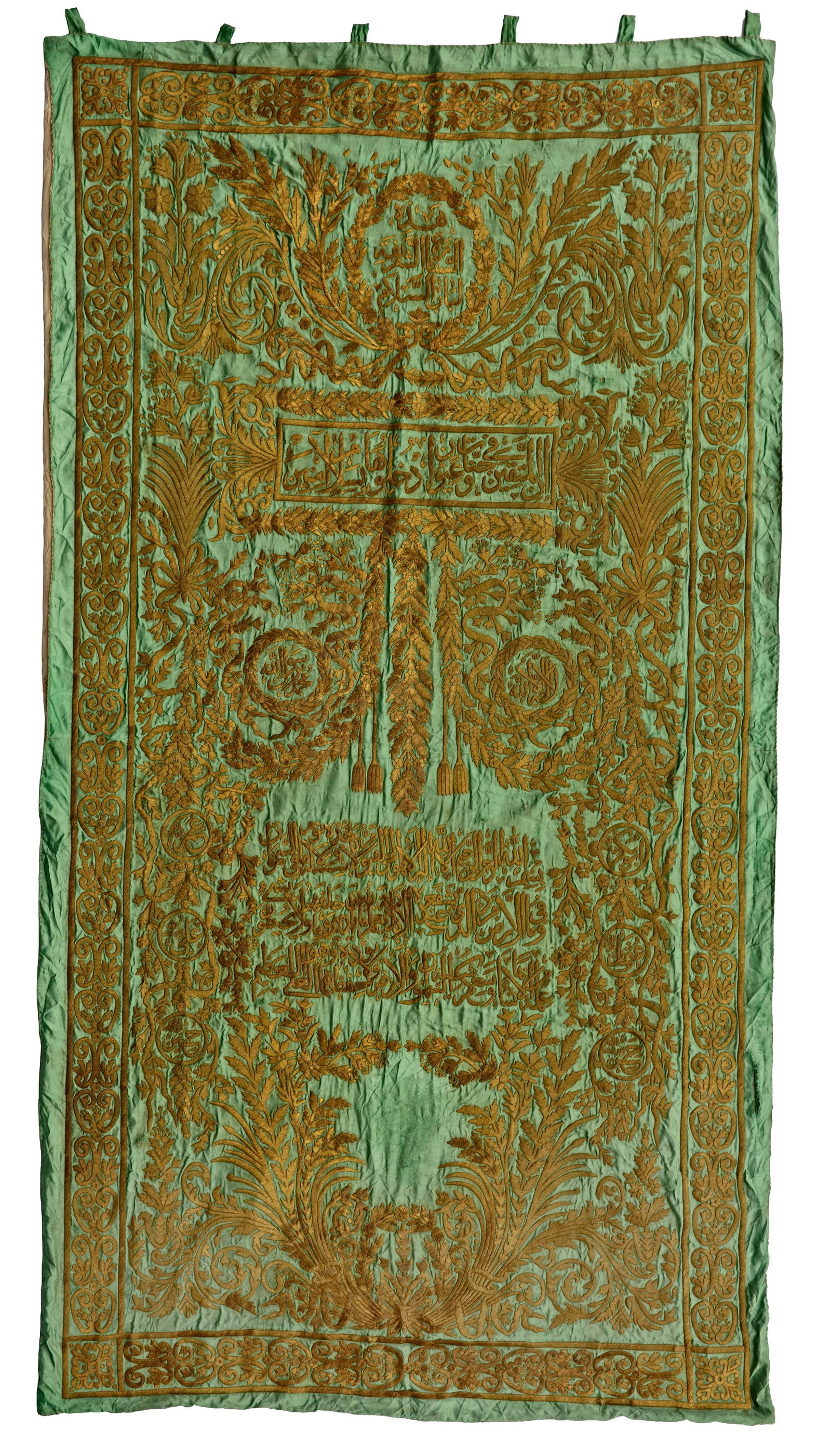 AN OTTOMAN METAL THREAD EMBROIDERED CURTAIN, TURKEY OR EGYPT, LATE 19TH CENTURY: Rectangular in form and richly embroidered in gilt threads on a predominantly green cotton ground, the composition is divided into two principal sections. The upper section features a rectangular pane