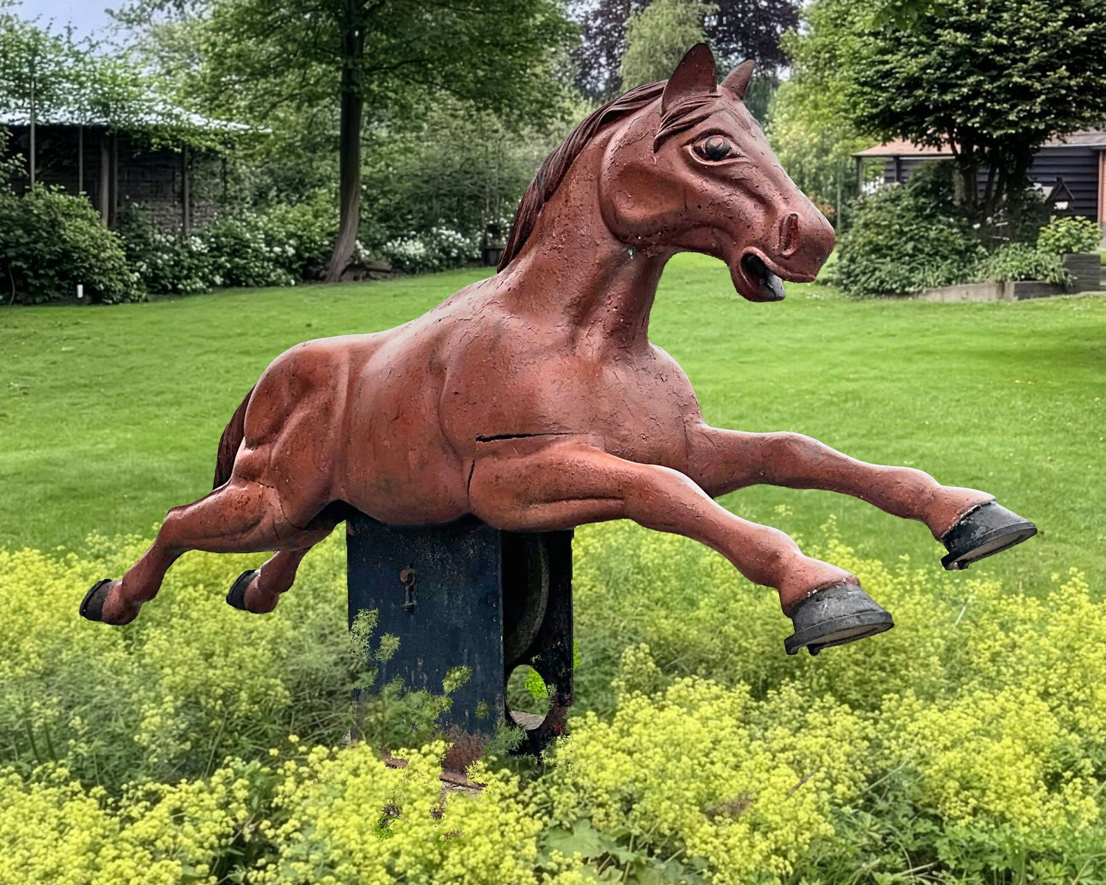 A RARE TOLE-PEINTE ALUMINIUM CAROUSEL HORSE, MID 20TH CENTURY: Set on a iron rocker base and plinth support 114 cm. Height overall approximately 184 cm. long.
