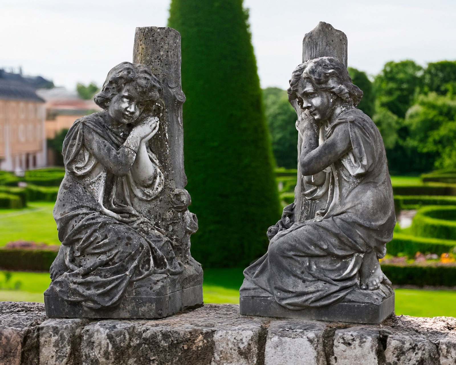 A PAIR OF CARVED WHITE MARBLE KNEELING CHILDREN AGAINST A TREE TRUNK BY F. BUSELL, FRENCH, LATE 19TH: Placed on a plinth, signed F. Busell. Height 84 cm. Width 38 cm. Depth 32 cm.