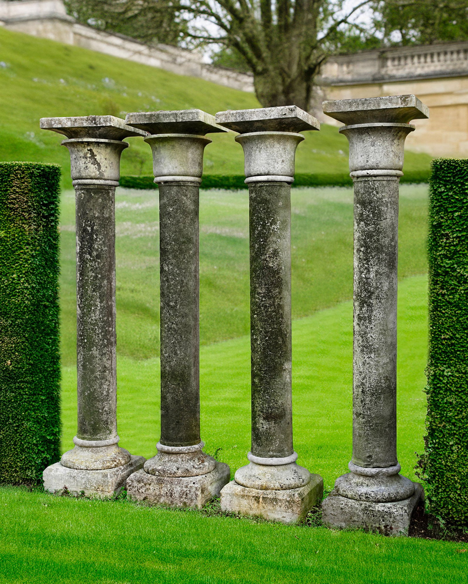 A SET OF FOUR CARVED LIMESTONE COLUMNS, 20TH CENTURY (1 of 1)