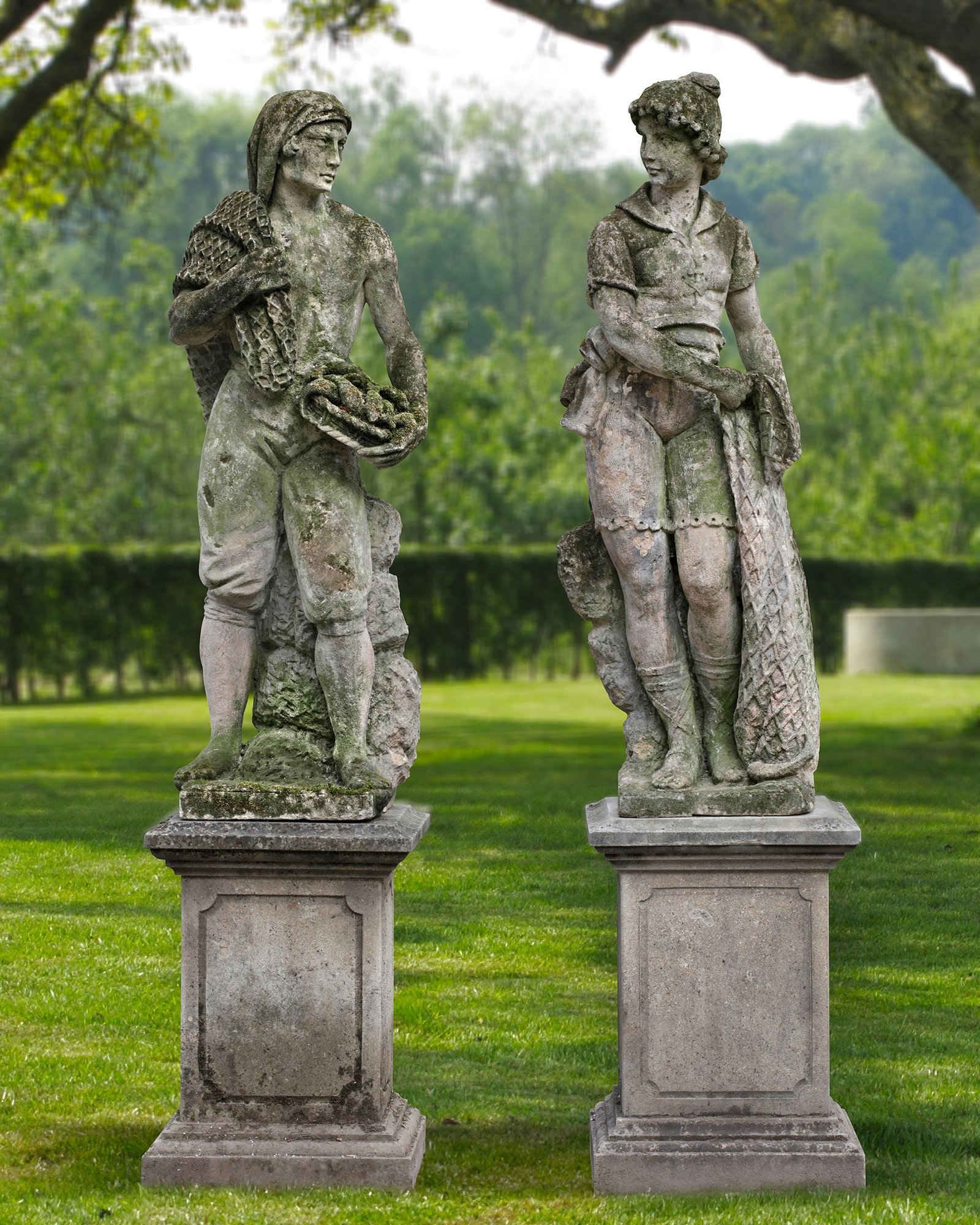 A PAIR OF SCULPTED LIMESTONE MODELS OF FISHERMEN, 19TH CENTURY: The left fisherman carries a fishing net over his shoulder and holds a basket with fish in left his hand. His clothing is simple and functional, consisting of a headscarf and shorts. The other, also w