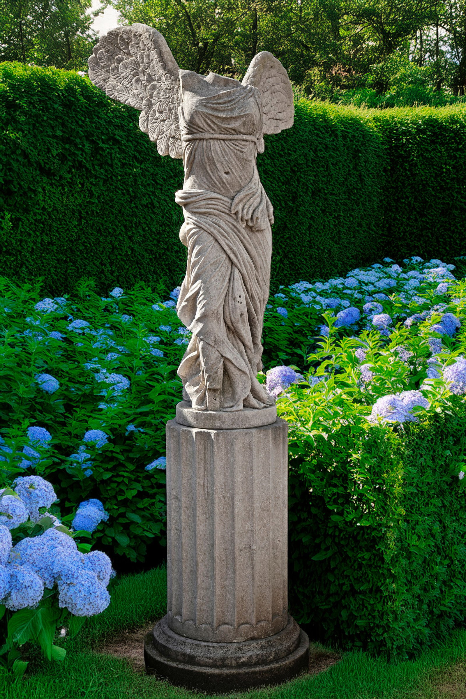 A SCULPTED LIMESTONE MODEL OF THE SAMOTHRACE NIKE, LATE 20TH CENTURY: Carved after the Antique, with wings outstretched and drapery billowing around, atop a cylindrical stone fluted pedestal. Height of the figure 145 cm. Height of the pedestal 100 cm. Height overall 245