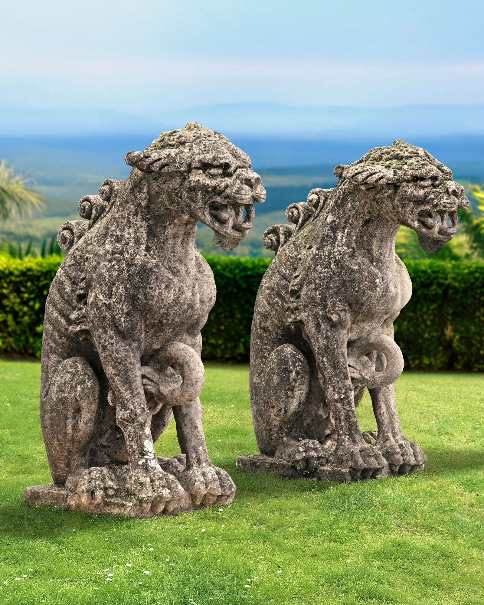 A PAIR OF COMPOSITION STONE DRAGONS, 19TH CENTURY: A sitting dragon is a guardian. The seated position suggests that the dragon has its enormous powers under control. This symbolizes inner peace, self-control, and deep wisdom. Height overall 127 cm. D