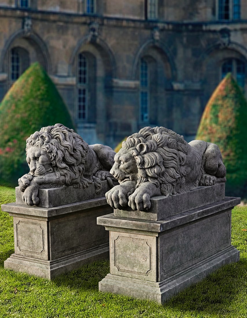 A PAIR OF SCULPTED LIMESTONE MODELS OF RECUMBENT LIONS SECOND HALF 20TH CENTURY, AFTER ANTONIO: Each typically portrayed with forepaw resting above the other, on integrally carved rectangular pedestals. Height each 77 cm. Atop rectangular section pedestals, each height 70 cm. length 160 cm. widt
