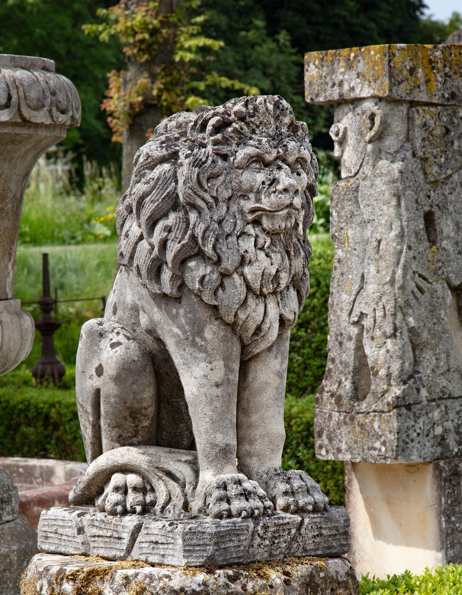 A SCULPTED LIMESTONE MODEL OF A SEATED LION, FIRST QUARTER 20TH CENTURY (1 of 1)